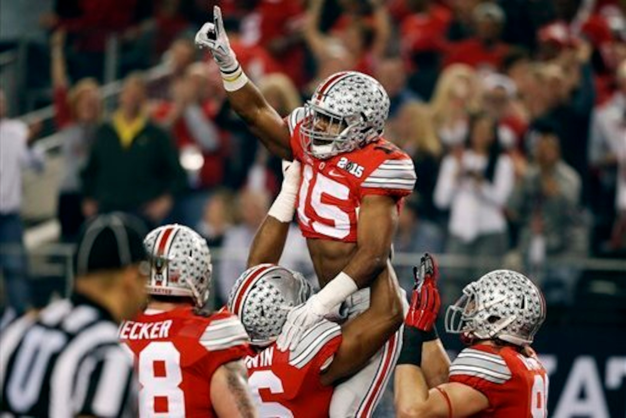 Ezekiel Elliott (15) and Ohio State earned a spot in the College Football Playoff by winning the Big Ten championship. Ezekiel Elliott (15) and Ohio State earned a spot in the College Football Playoff by winning the Big Ten championship.