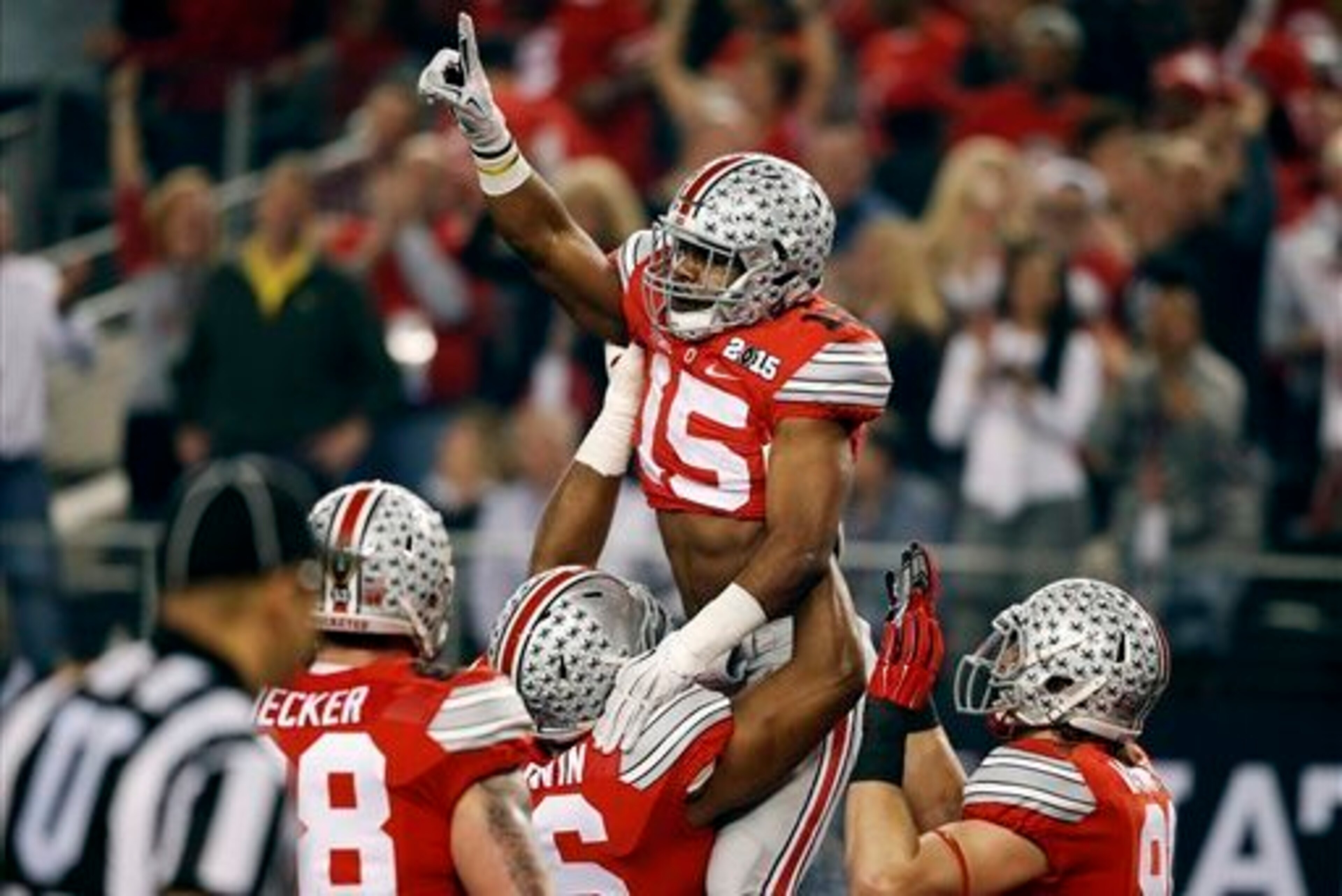 Ezekiel Elliott (15) and Ohio State earned a spot in the College Football Playoff by winning the Big Ten championship. Ezekiel Elliott (15) and Ohio State earned a spot in the College Football Playoff by winning the Big Ten championship.