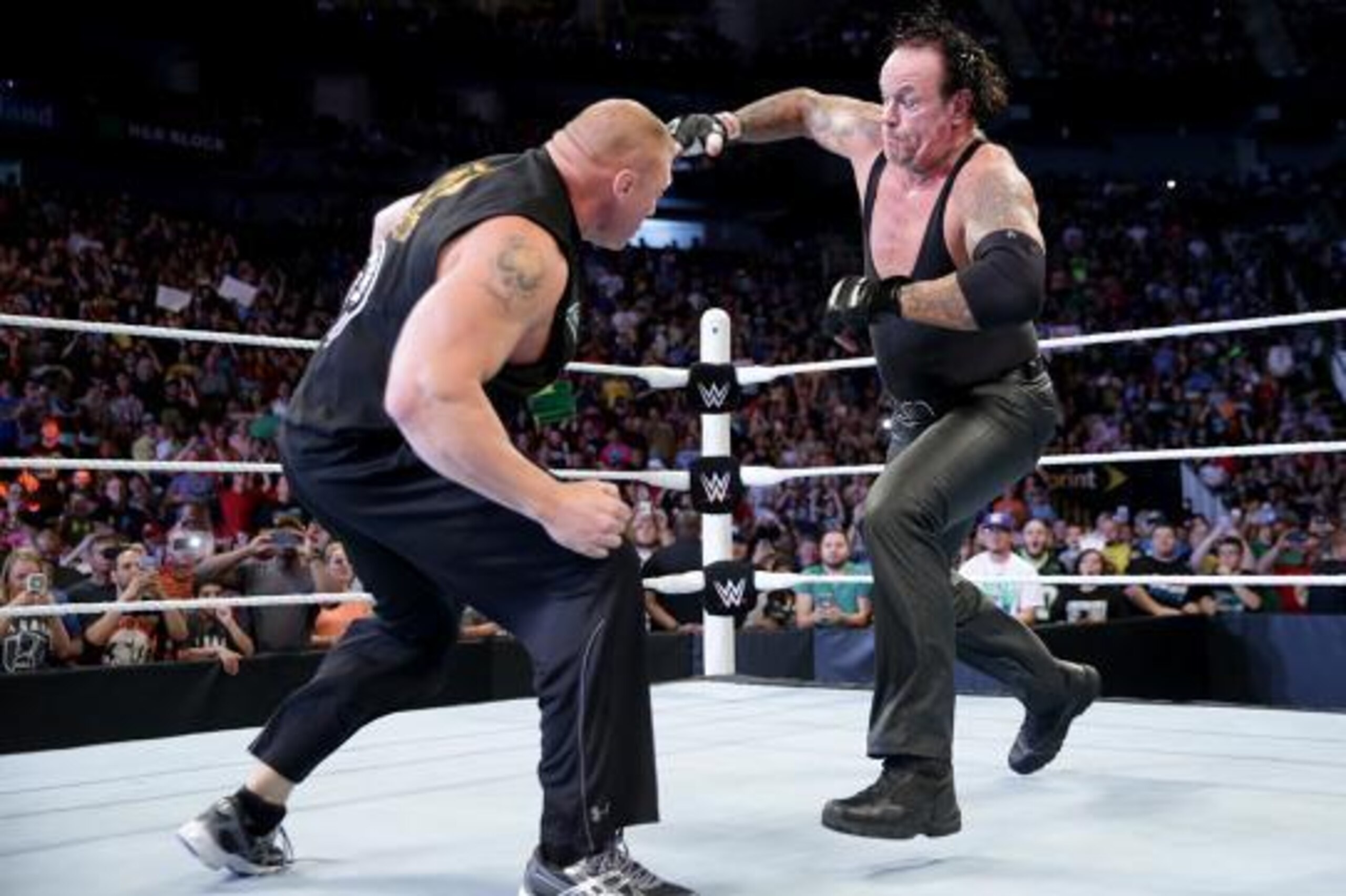 Chaos ensues when Brock Lesnar and Undertaker engage in a brawl for the ages.