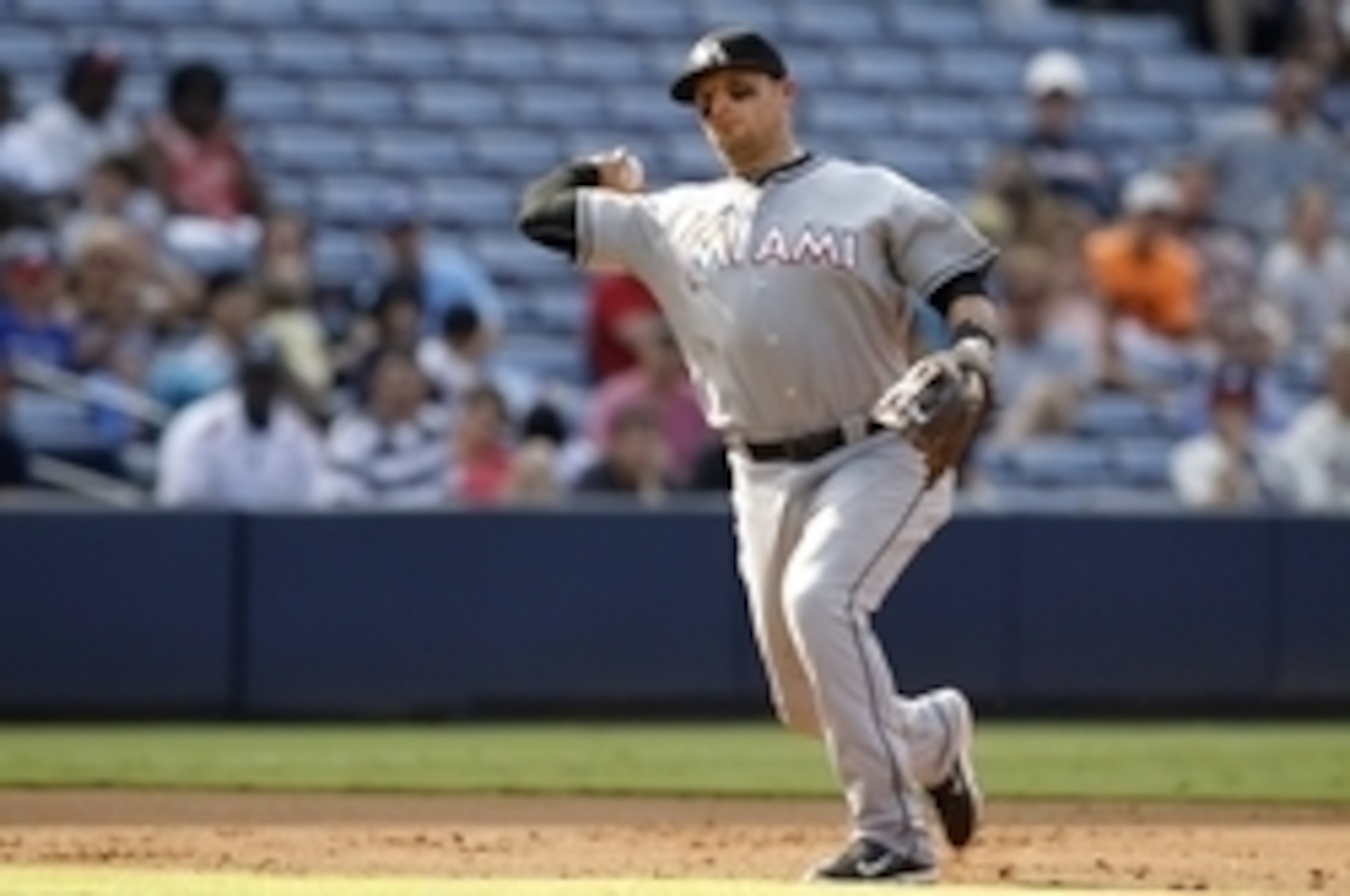 Aug 9, 2015; Atlanta, GA, USA; Miami Marlins third baseman Martin Prado (14) throws a runner out at first against the Atlanta Braves in the second inning at Turner Field. Mandatory Credit: Brett Davis-USA TODAY Sports