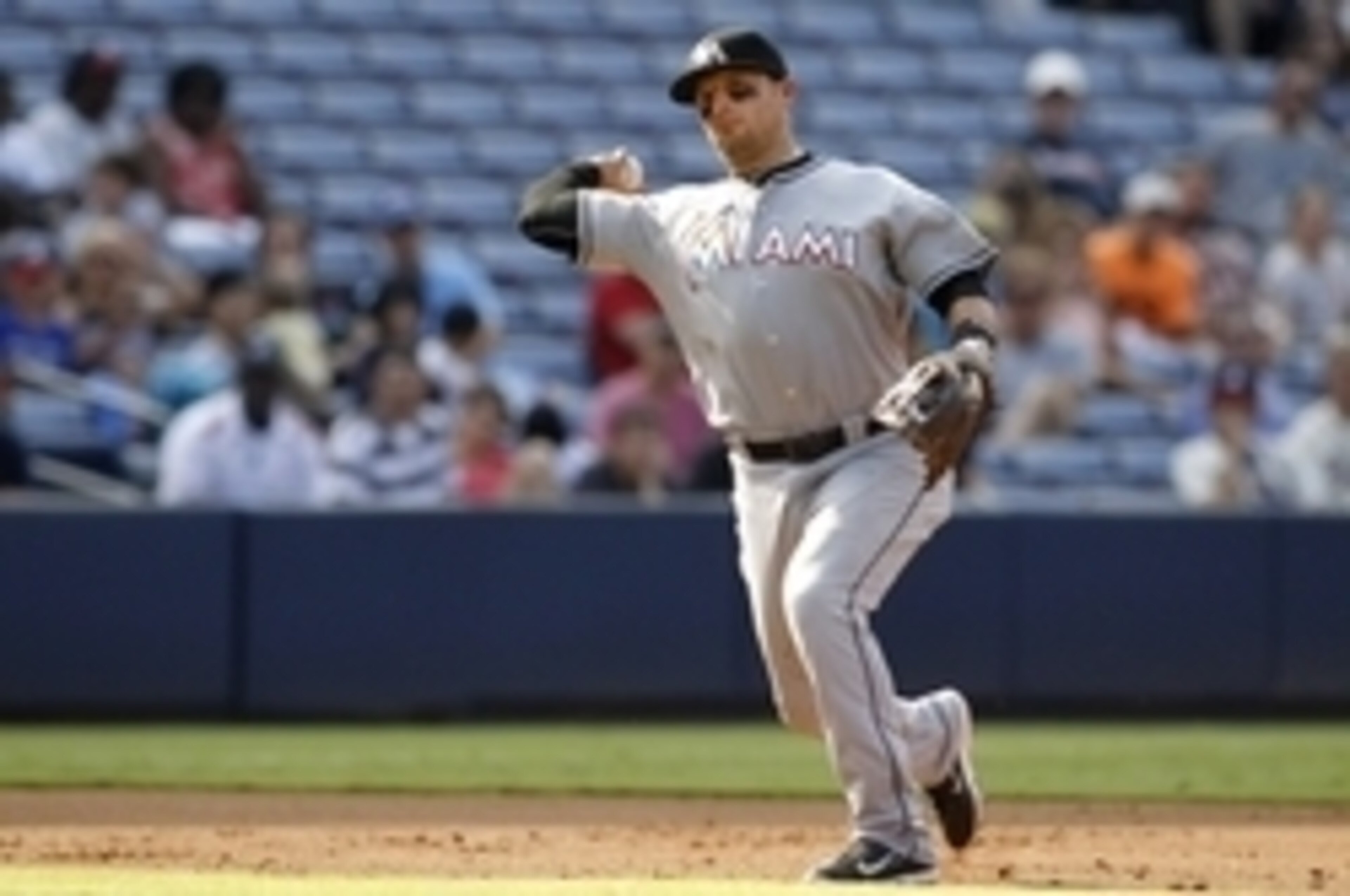 Aug 9, 2015; Atlanta, GA, USA; Miami Marlins third baseman Martin Prado (14) throws a runner out at first against the Atlanta Braves in the second inning at Turner Field. Mandatory Credit: Brett Davis-USA TODAY Sports