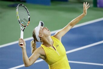 Caroline Wozniacki serves during a match at the 2015 Western & Southern Open.