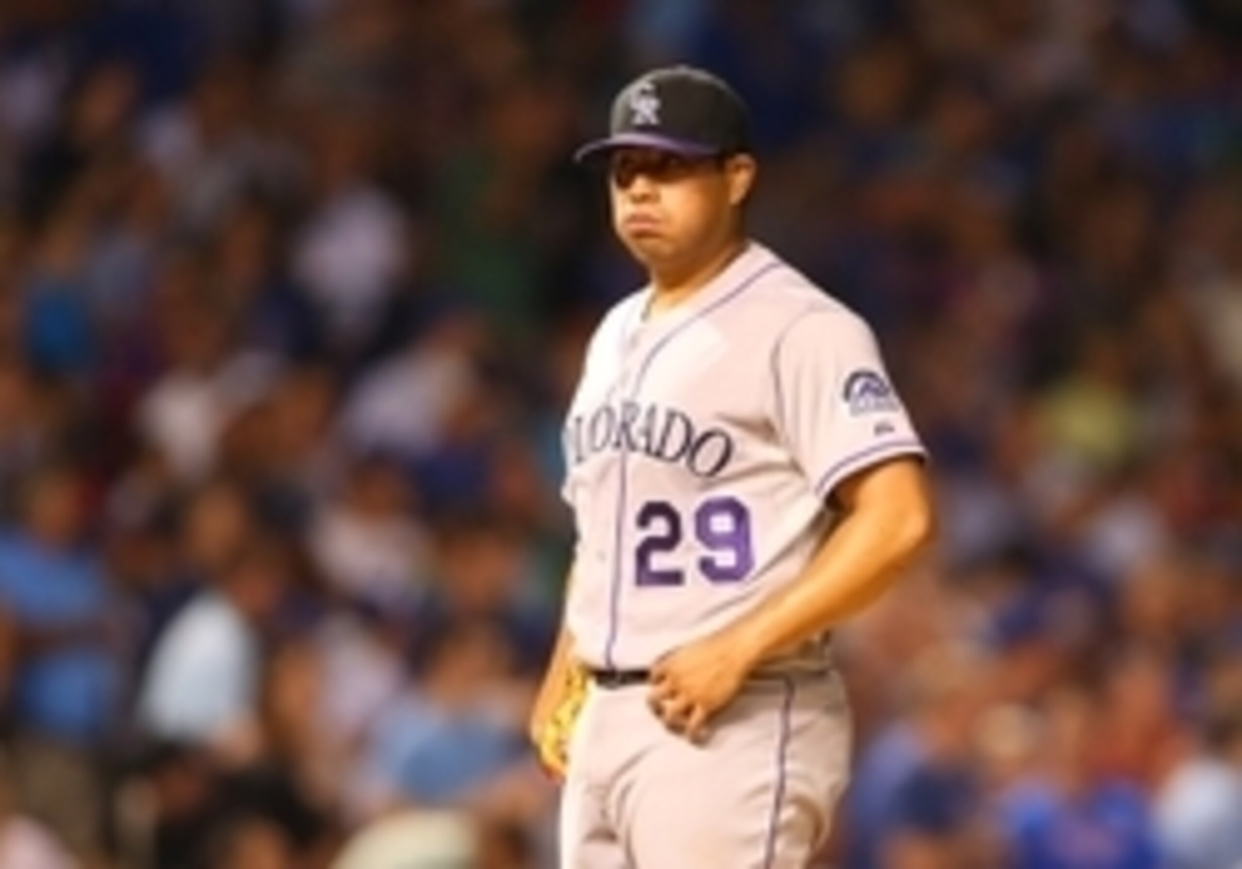 Jul 27, 2015; Chicago, IL, USA; Colorado Rockies starting pitcher Jorge De La Rosa (29) reacts after the Chicago Cubs score during the fourth inning at Wrigley Field. Mandatory Credit: Caylor Arnold-USA TODAY Sports