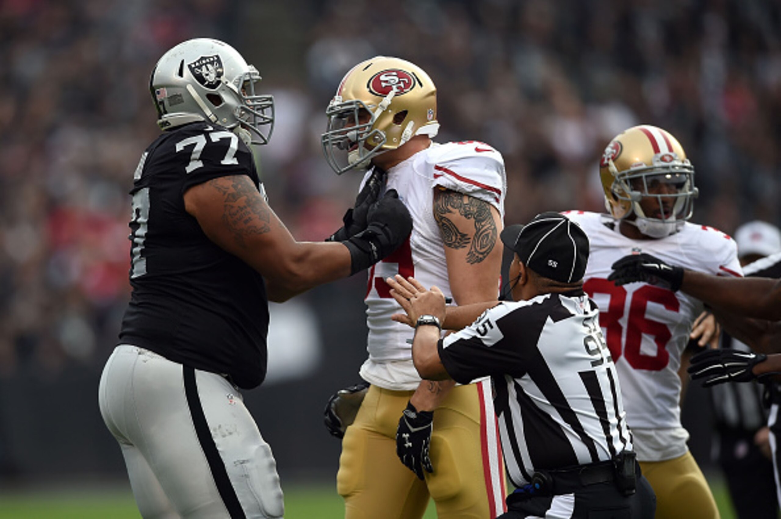Austin Howard roughing up a 49ers player.