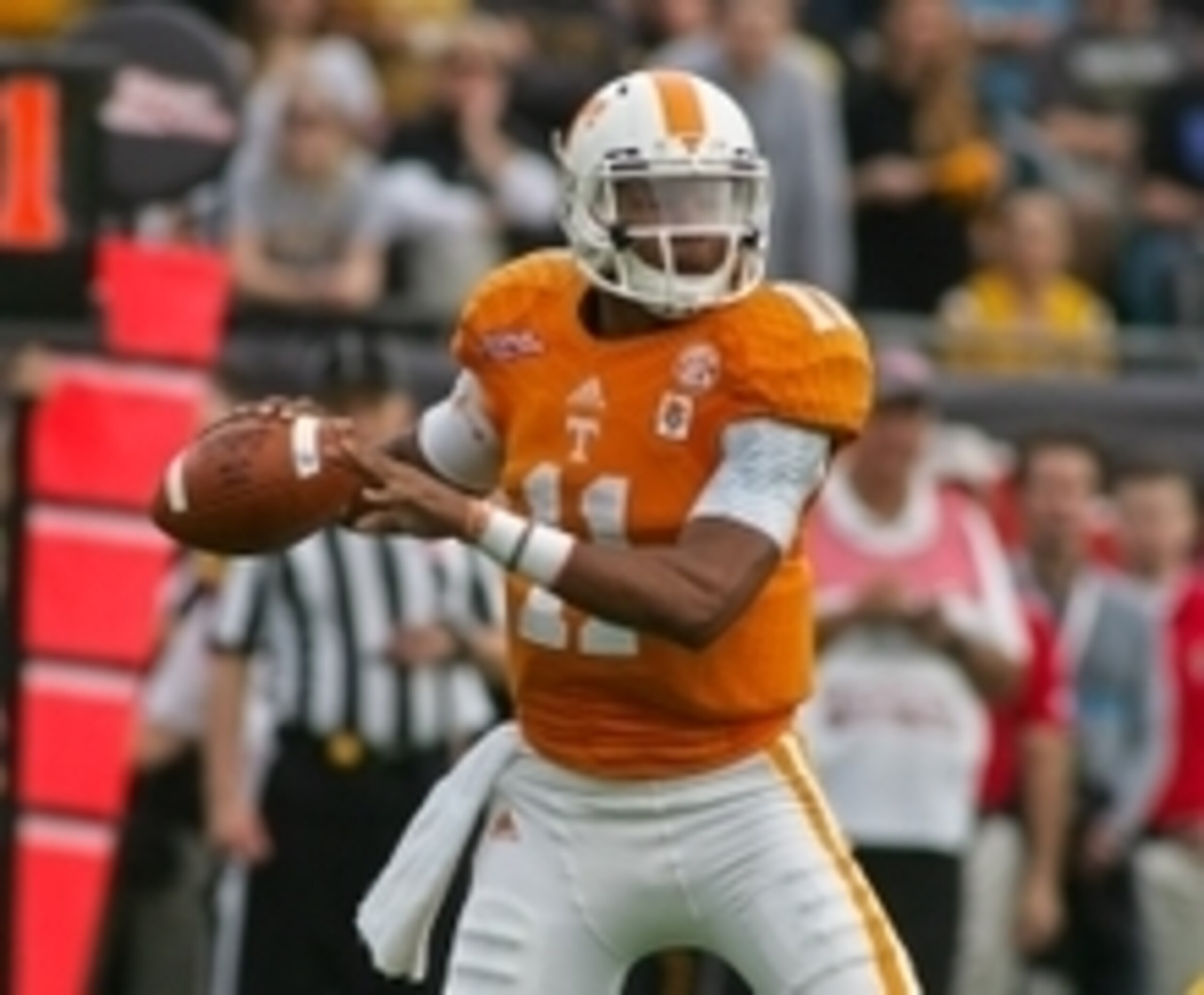 Jan 2, 2015; Jacksonville, FL, USA; Tennessee Volunteers quarterback Joshua Dobbs (11) looks for a receiver in the first quarter of the 2015 TaxSlayer Bowl against the Iowa Hawkeyes at EverBank Field. The Tennessee Volunteers beat the Iowa Hawkeyes 45-28. Jan 2, 2015; Jacksonville, FL, USA; Tennessee Volunteers quarterback Joshua Dobbs (11) looks for a receiver in the first quarter of the 2015 TaxSlayer Bowl against the Iowa Hawkeyes at EverBank Field. The Tennessee Volunteers beat the Iowa Hawkeyes 45-28.