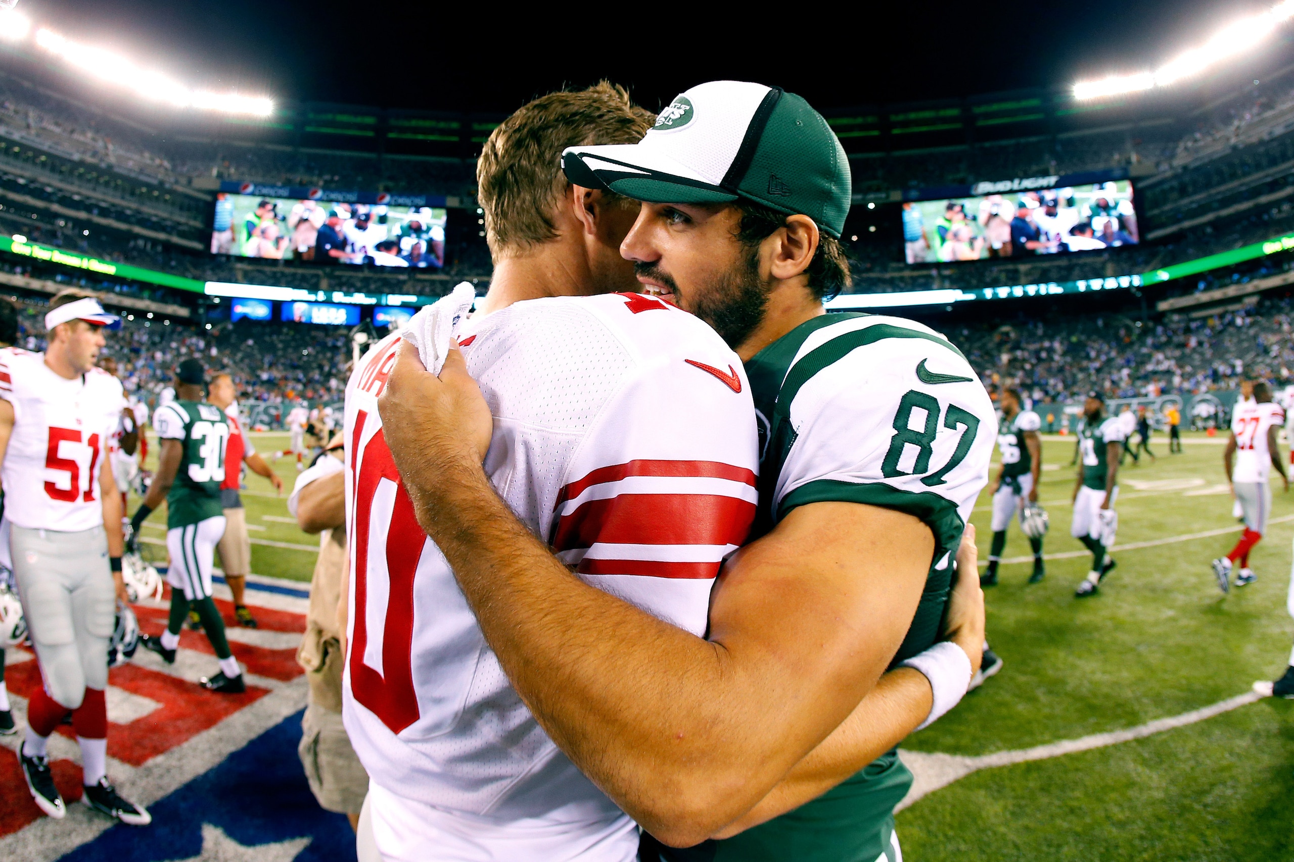New York Jets receiver Eric Decker and Giants quarterback Eli Manning New York Jets receiver Eric Decker and Giants quarterback Eli Manning