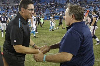 Ron Rivera and Bill Belichick shake hands after New England's victory.