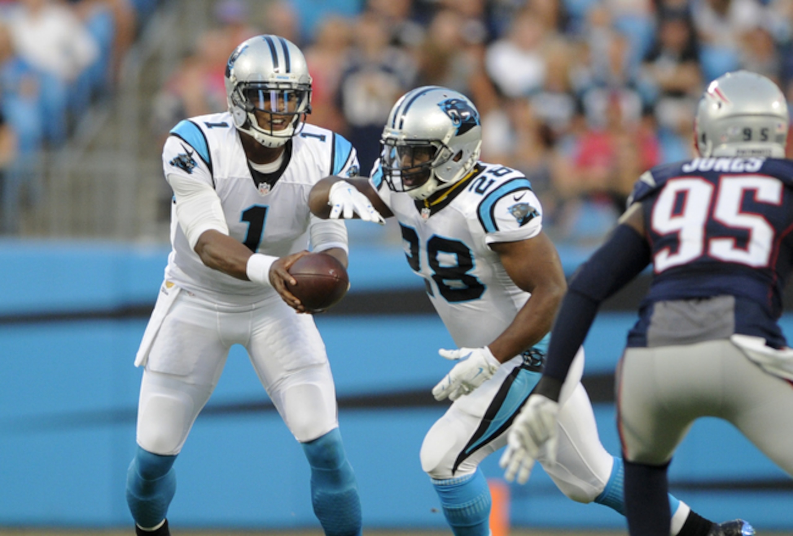 Cam Newton (No. 1) and Jonathan Stewart (No. 28)
