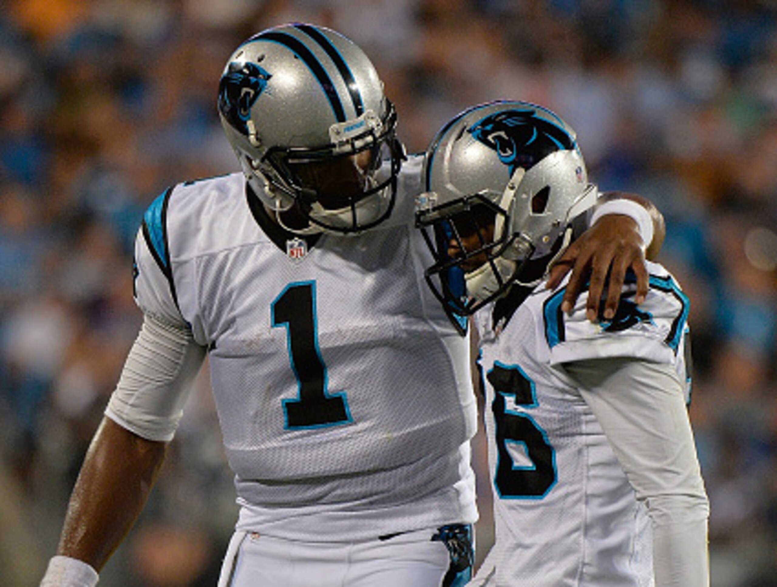 Cam Newton comforts Corey Brown.