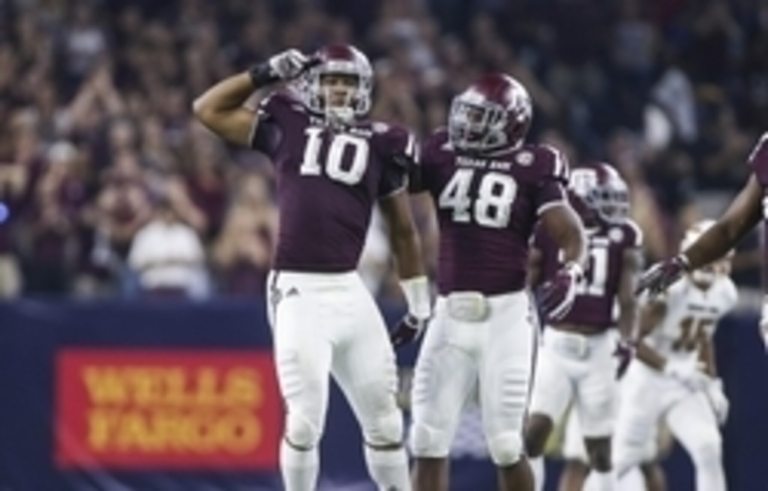 Texas A&M DE Daeshon Hall (left)