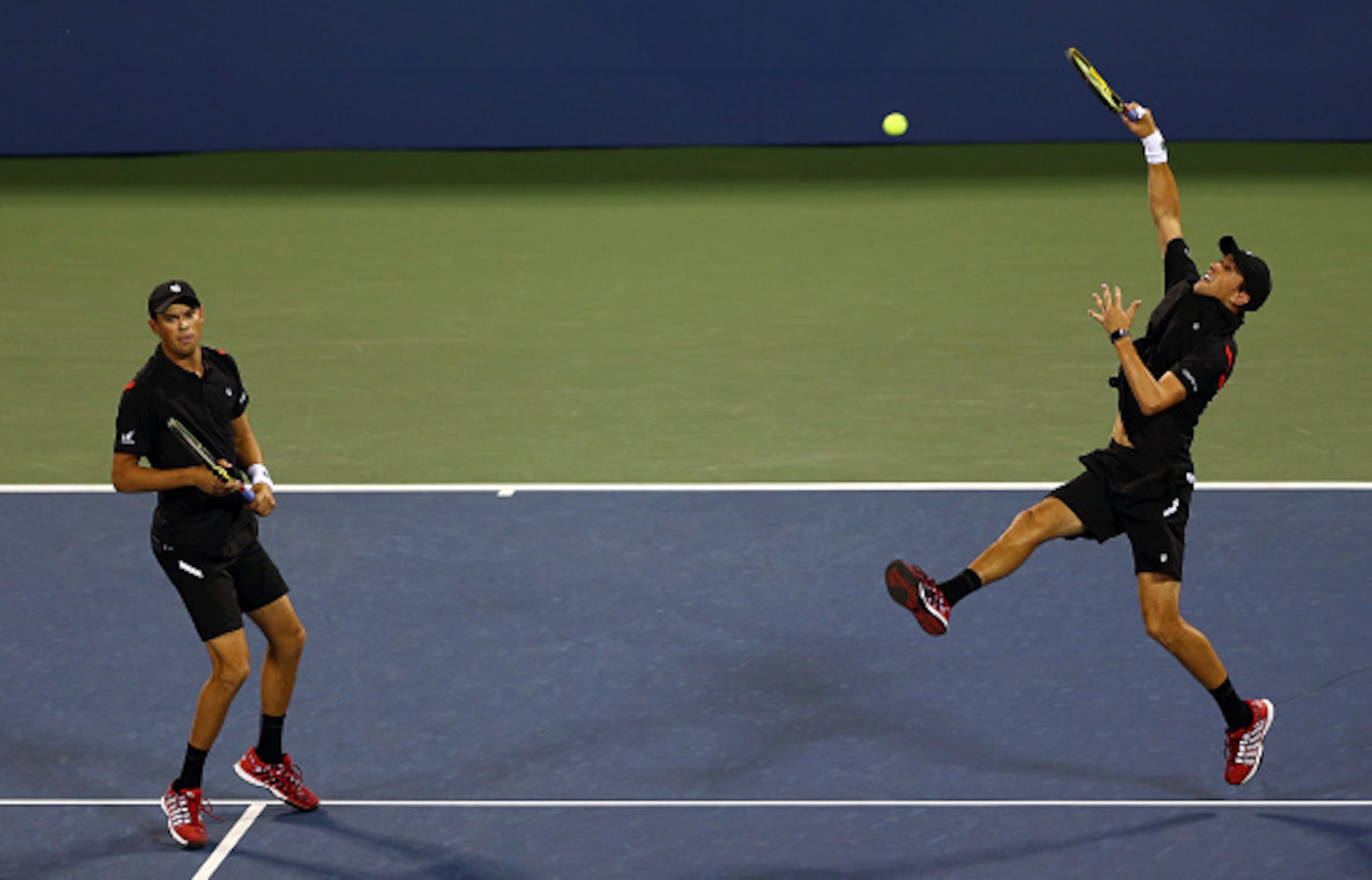 Bob and Mike Bryan during their opening-round loss at the 2015 U.S. Open.