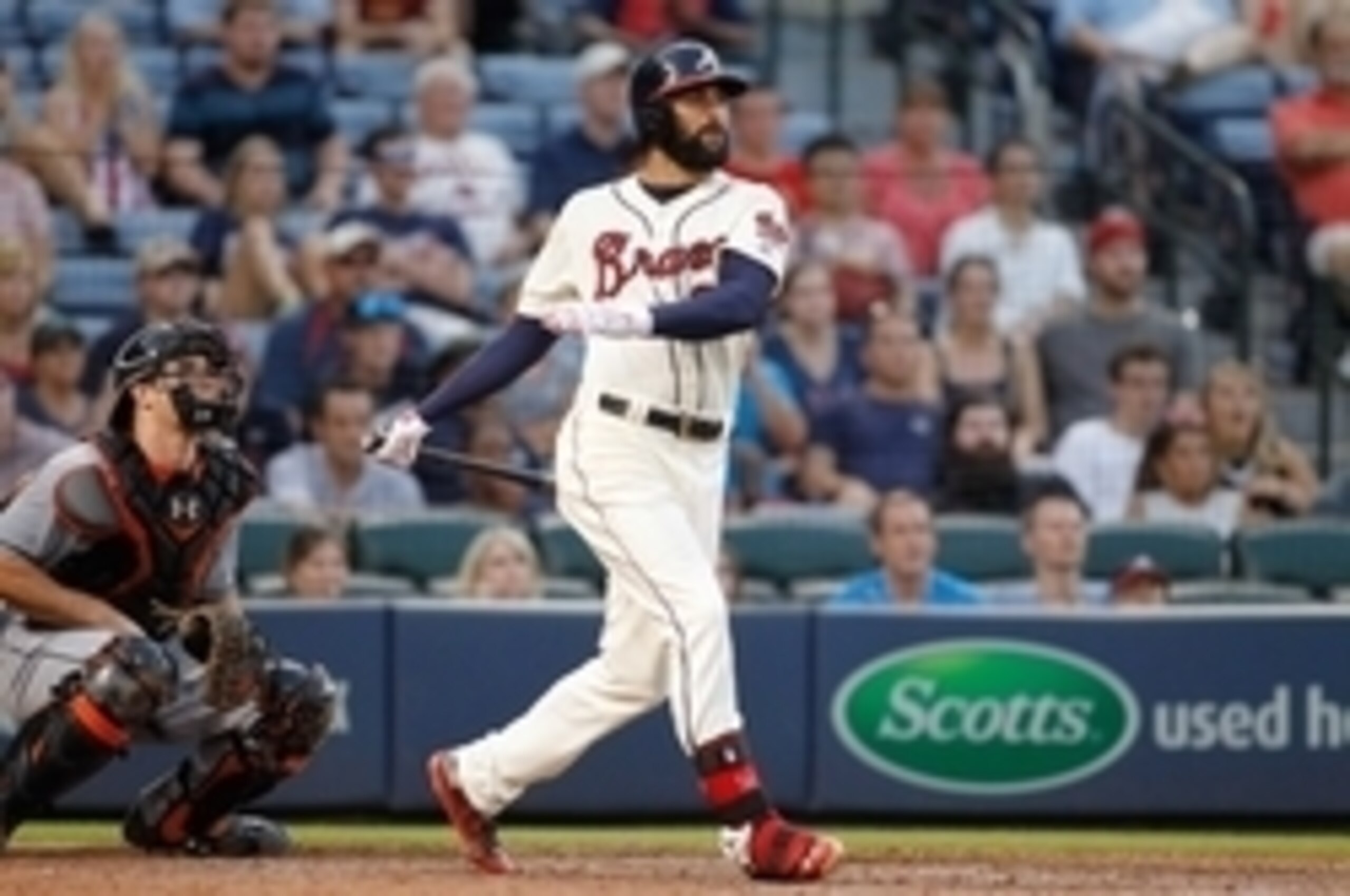 Aug 9, 2015; Atlanta, GA, USA; Atlanta Braves right fielder Nick Markakis (22) hits the ball against the Miami Marlins in the eighth inning at Turner Field. Mandatory Credit: Brett Davis-USA TODAY Sports