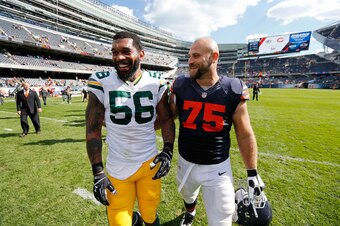 Former Bear Julius Peppers (left) had his way in the early going against new Bears right tackle Kyle Long.