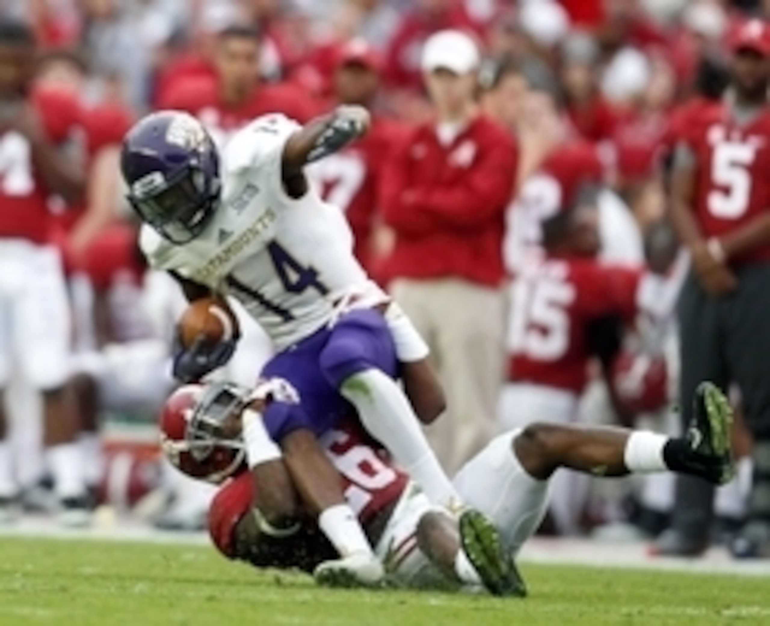 Nov 22, 2014; Tuscaloosa, AL, USA; Western Carolina Catamounts wide receiver Karnorris Benson (14) is tackled by Alabama Crimson Tide defensive back Landon Collins (26) at Bryant-Denny Stadium. Mandatory Credit: Marvin Gentry-USA TODAY Sports