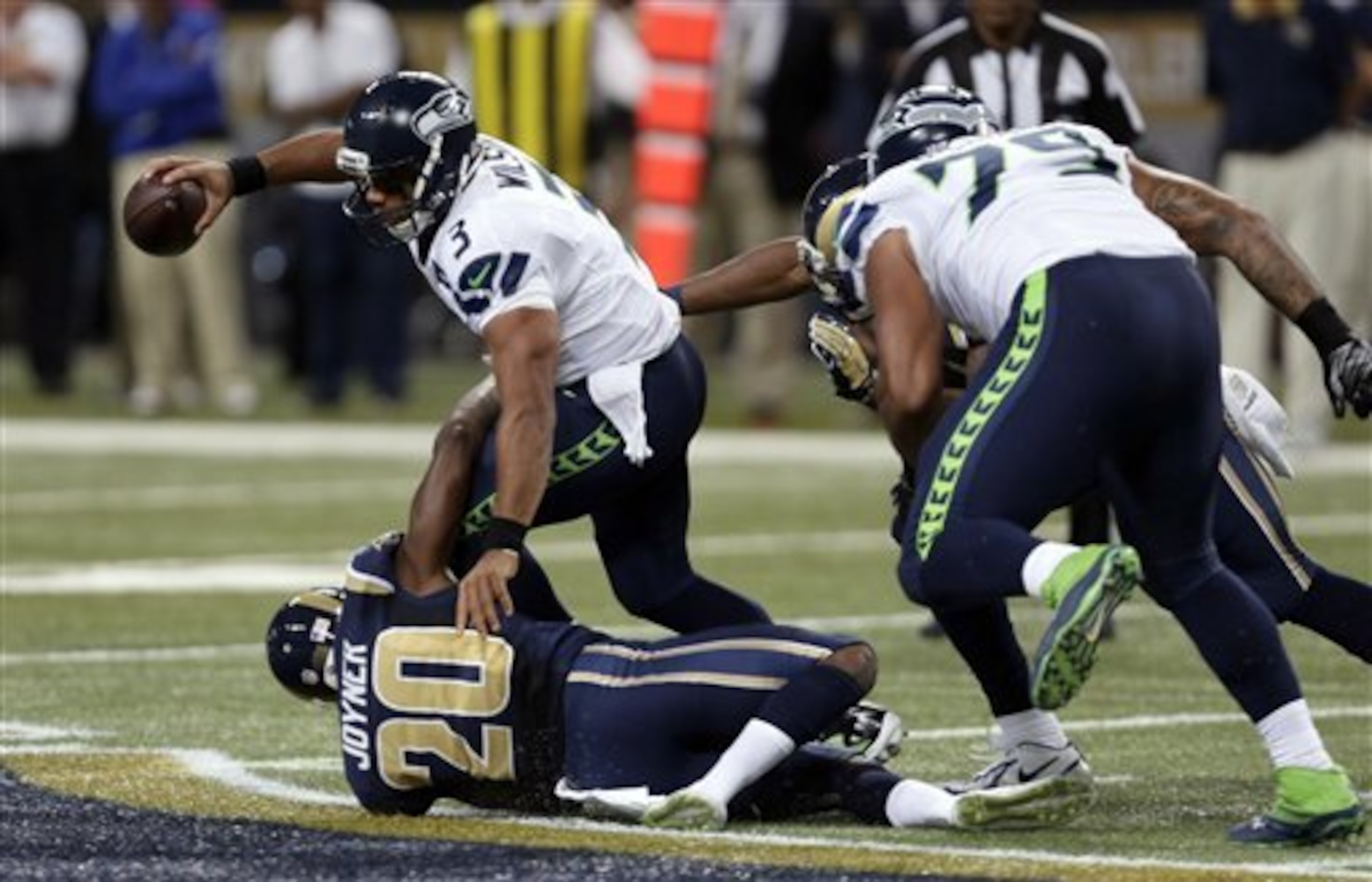 Seattle's new-look offensive line allowed Russell Wilson to be sacked six times.