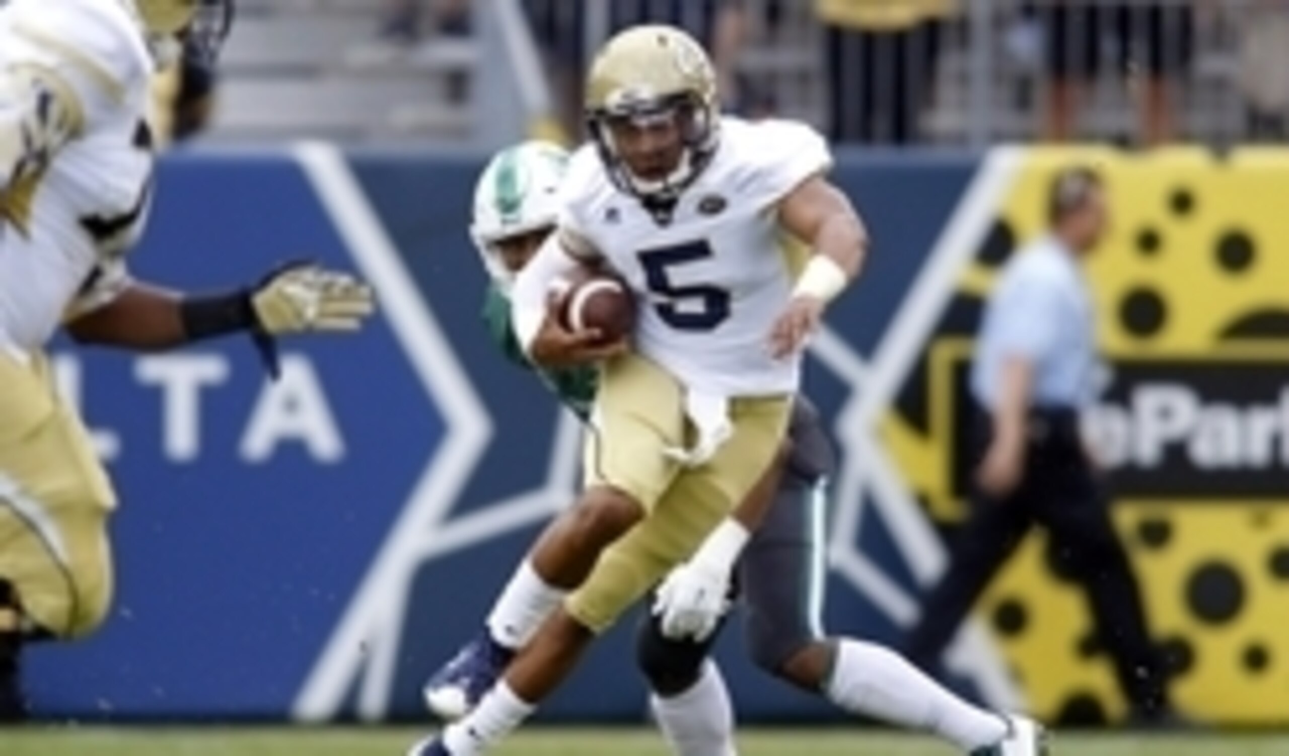 Sep 12, 2015; Atlanta, GA, USA; Georgia Tech Yellow Jackets quarterback Justin Thomas (5) runs the ball against the Tulane Green Wave in the first quarter at Bobby Dodd Stadium. Mandatory Credit: Brett Davis-USA TODAY Sports