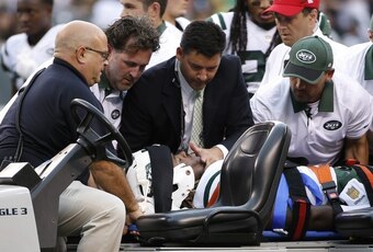 Lorenzo Mauldin is carted off the field during the Jets 31-10 victory over the Cleveland Browns