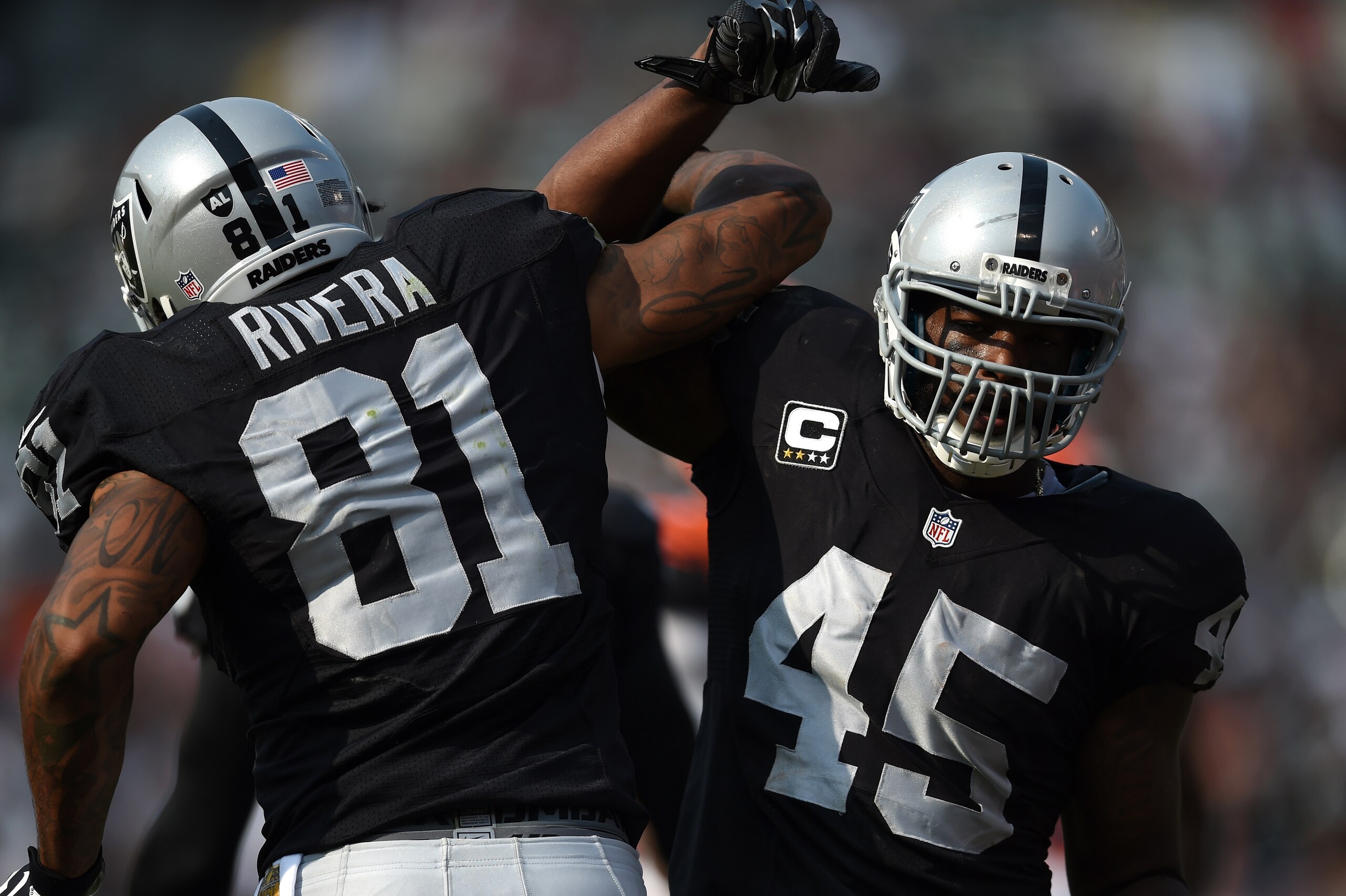 No. 81 Mychal Rivera and No. 45 Marcel Reece
