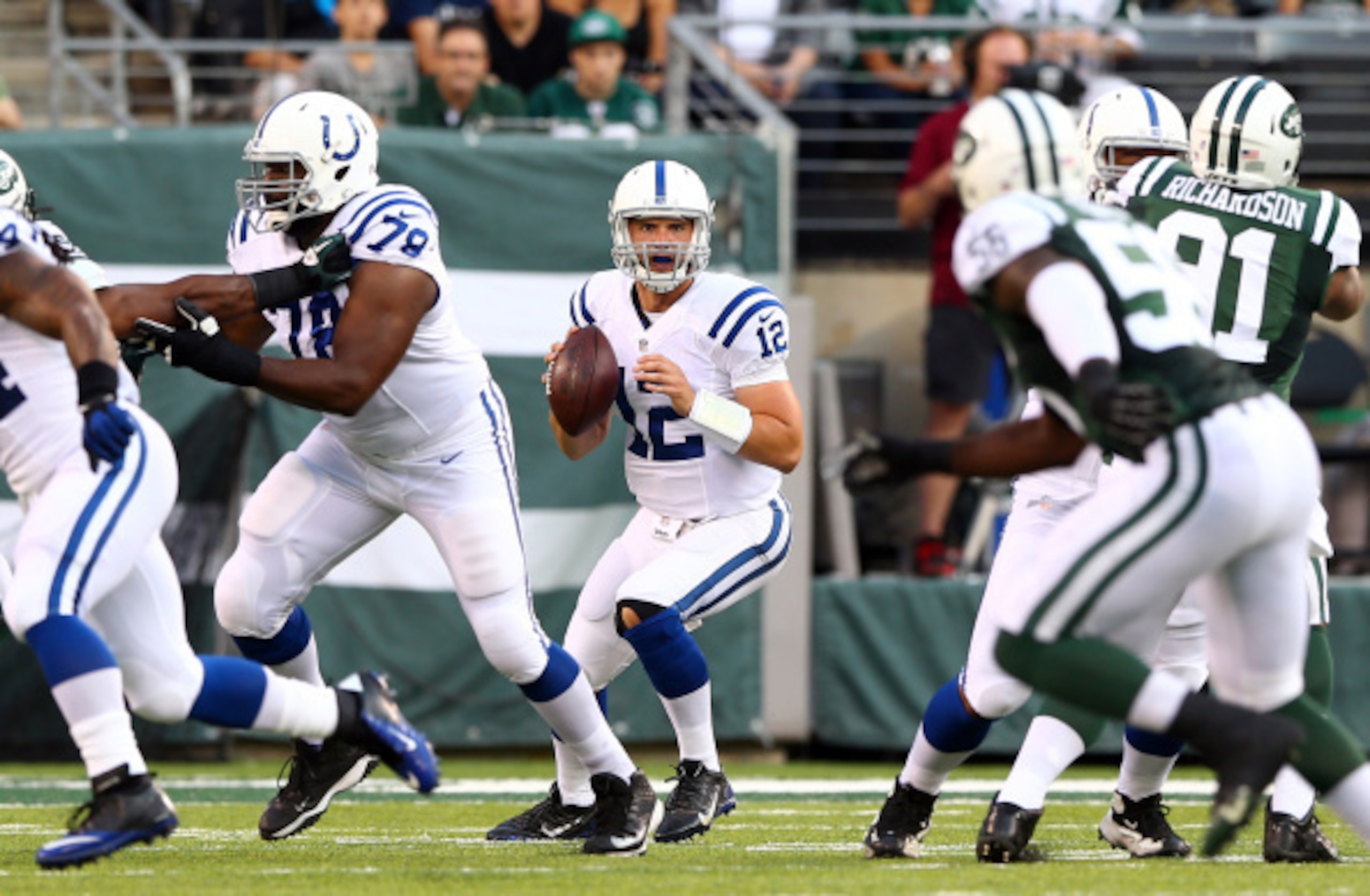 EAST RUTHERFORD, NJ - AUGUST 07: Quarterback Andrew Luck #12 of the Indianapolis Colts drops back to pass against the New York Jets during a preseason game at MetLife Stadium on August 7, 2014 in East Rutherford, New Jersey.  (Photo by Elsa/Getty Images)