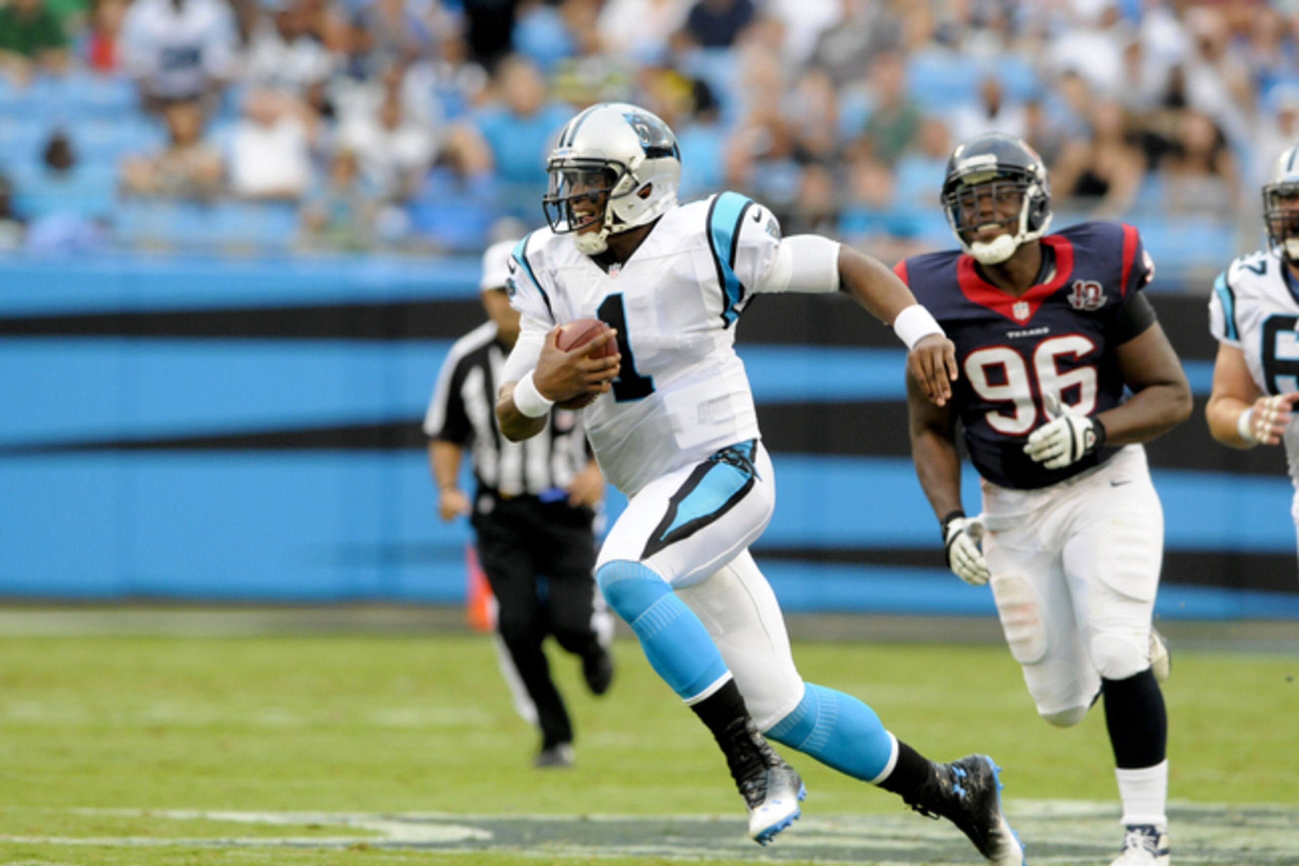Cam Newton scrambles during a 2012 preseason matchup with the Texans.