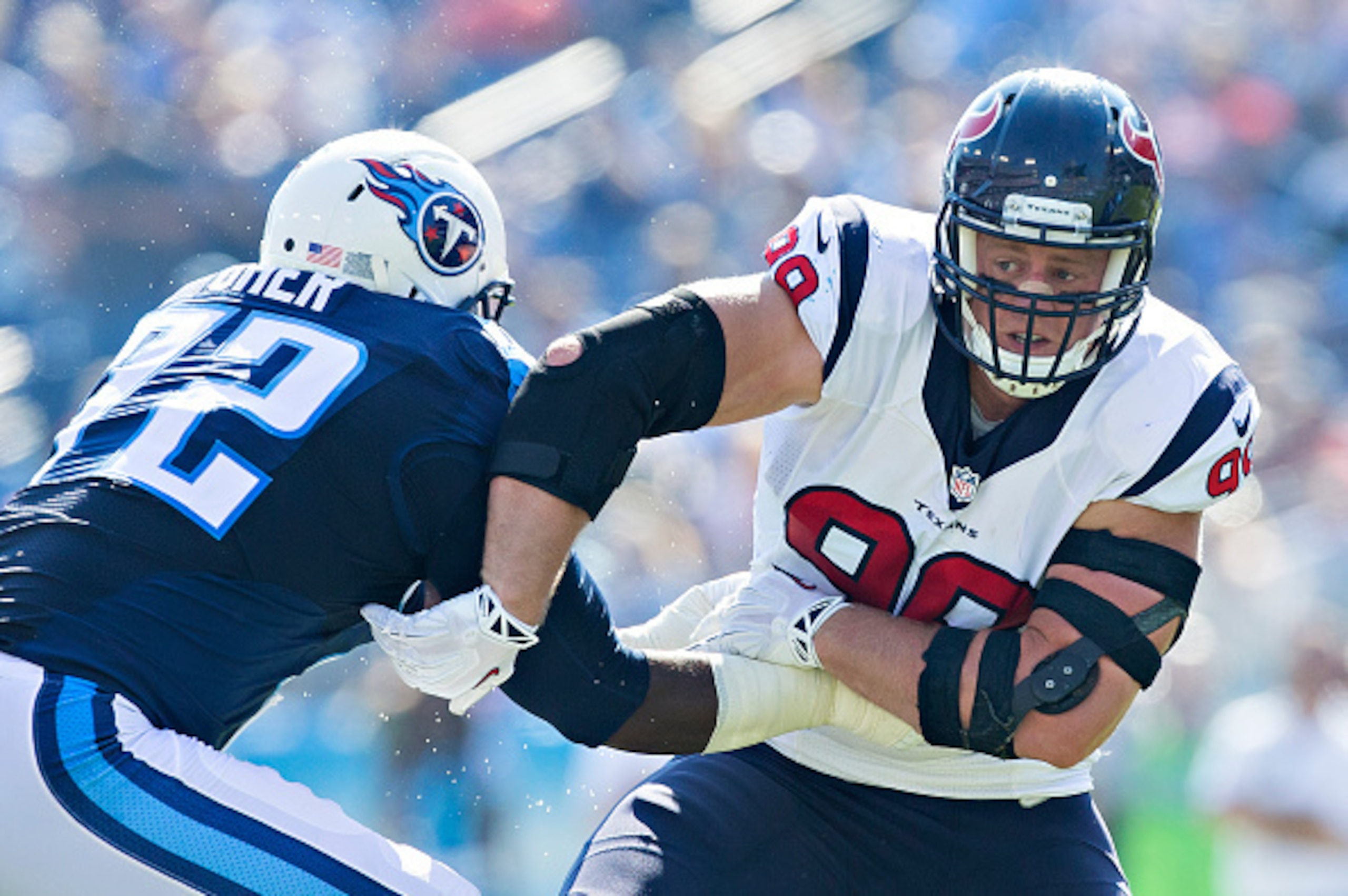NASHVILLE, TN - OCTOBER 26:  J.J. Watt #99 of the Houston Texans rushes the quarterback and is blocked by Michael Oher #72 of the Tennessee Titans at LP Field on October 26, 2014 in Nashville, Tennessee.  The Texans defeated the Titans 30-16.  (Photo by W