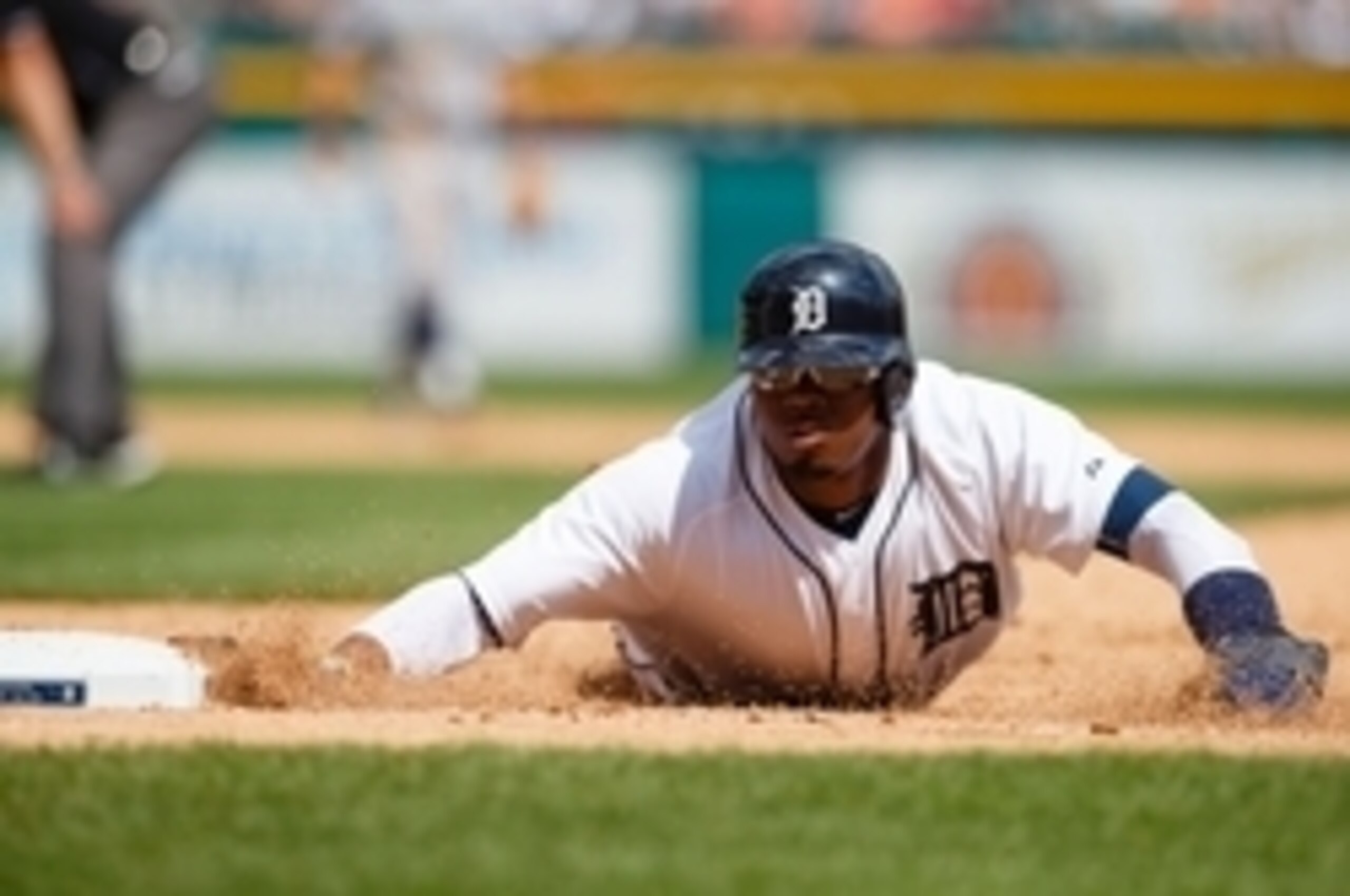 Jul 23, 2015; Detroit, MI, USA; Detroit Tigers center fielder Rajai Davis (20) dives back to first safe in the ninth inning against the Seattle Mariners at Comerica Park. Mandatory Credit: Rick Osentoski-USA TODAY Sports