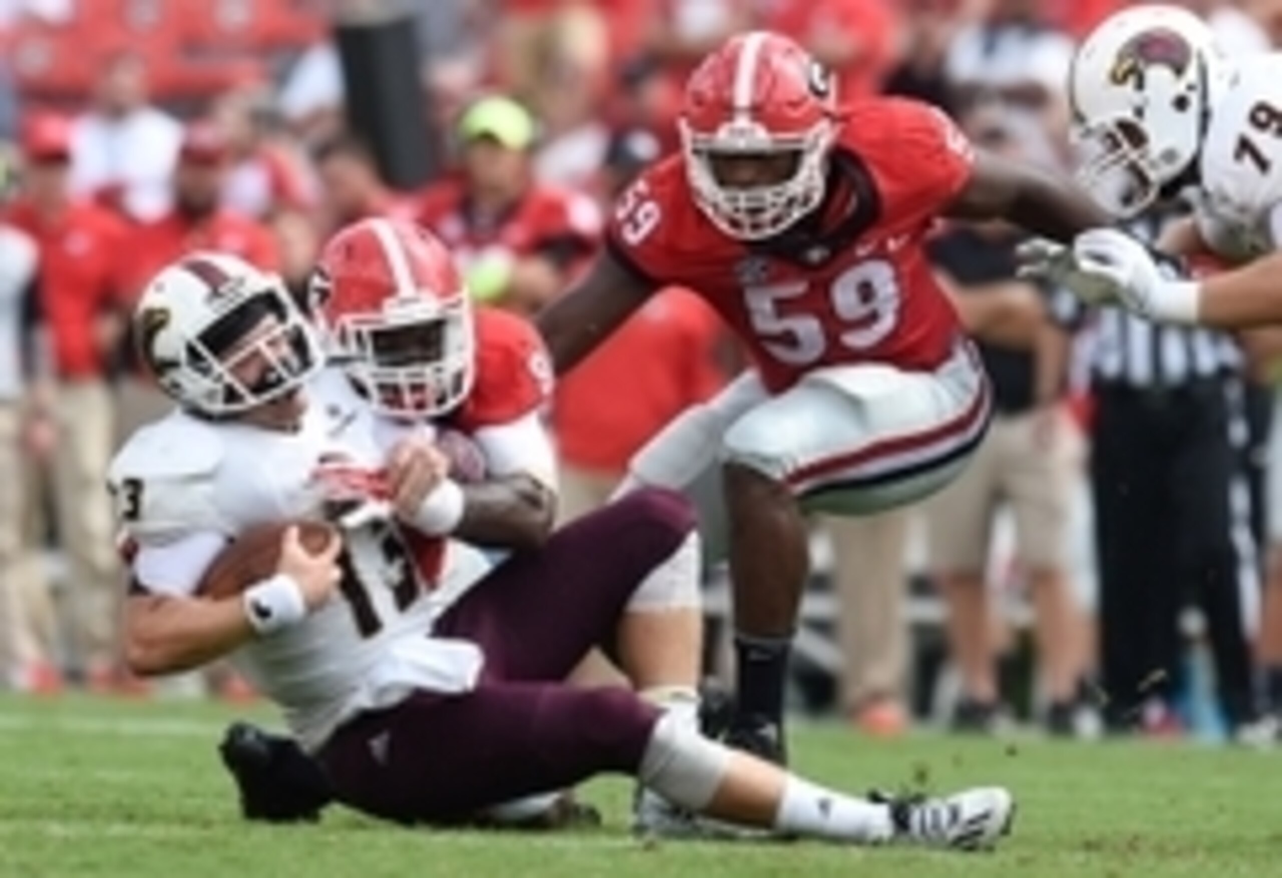 Sep 5, 2015; Athens, GA, USA; Georgia Bulldogs linebacker Leonard Floyd (84) tackles Louisiana Monroe Warhawks quarterback Garrett Smith (13) during the second half at Sanford Stadium. Georgia defeated Louisiana Monroe 51-14 in a game shortened by thunder Sep 5, 2015; Athens, GA, USA; Georgia Bulldogs linebacker Leonard Floyd (84) tackles Louisiana Monroe Warhawks quarterback Garrett Smith (13) during the second half at Sanford Stadium. Georgia defeated Louisiana Monroe 51-14 in a game shortened by thunder