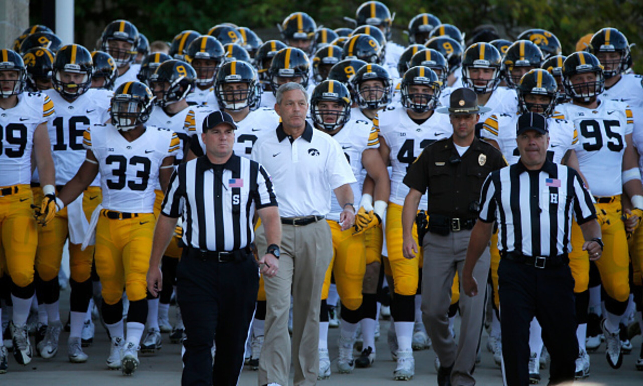 Iowa HC Kirk Ferentz (center) Iowa HC Kirk Ferentz (center)