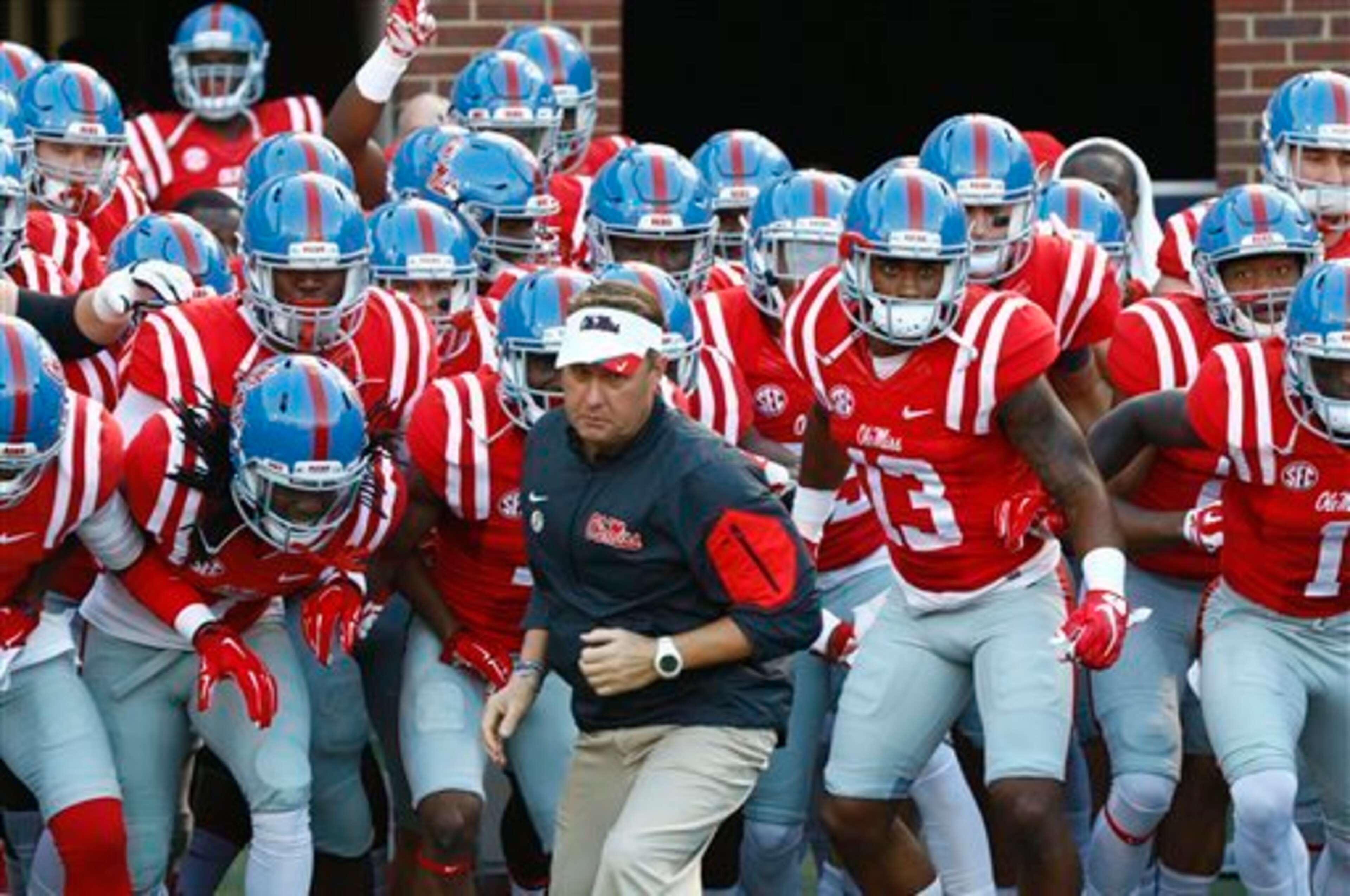 Ole Miss HC Hugh Freeze (center) Ole Miss HC Hugh Freeze (center)