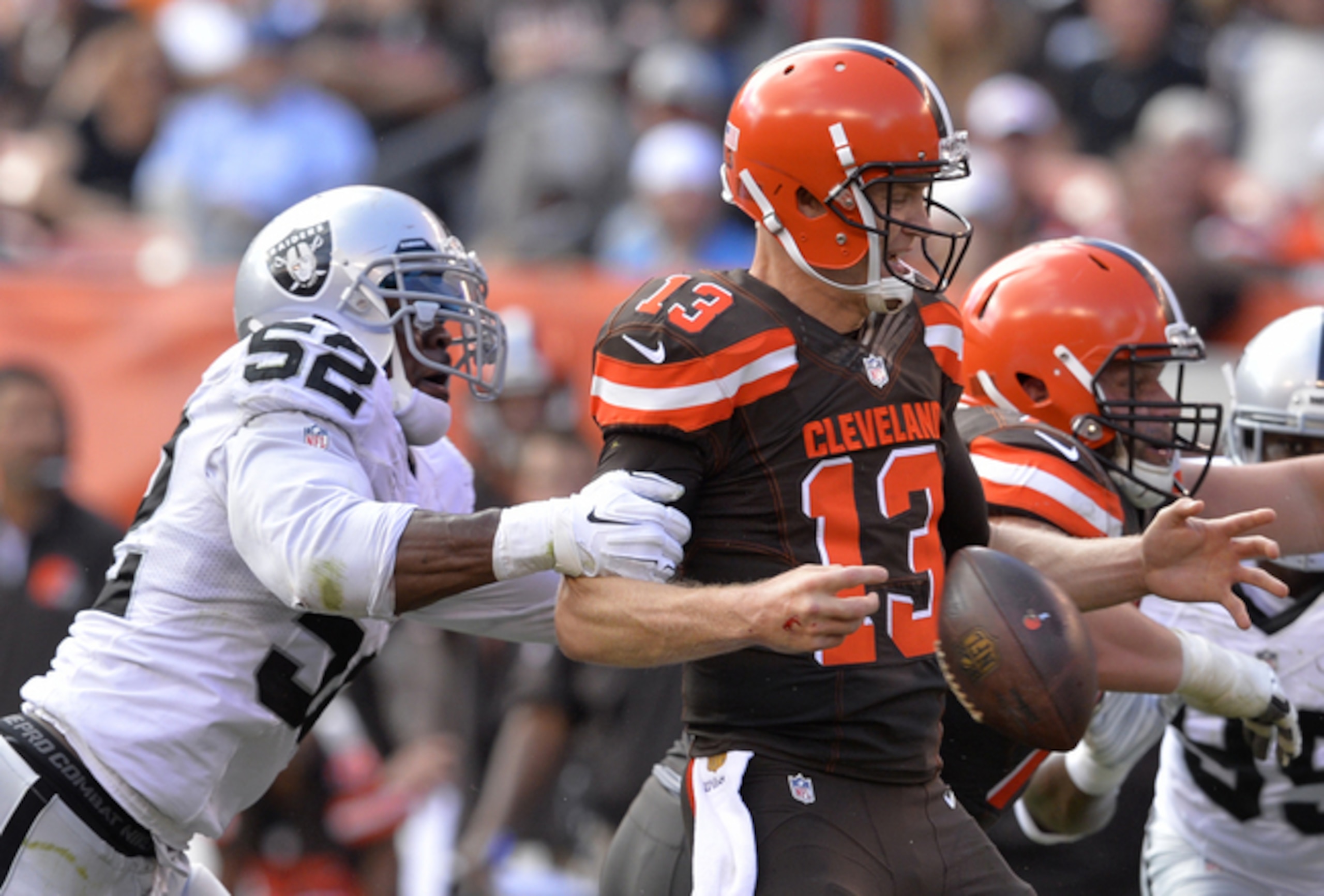 DE Khalil Mack stripping QB Josh McCown of the ball.