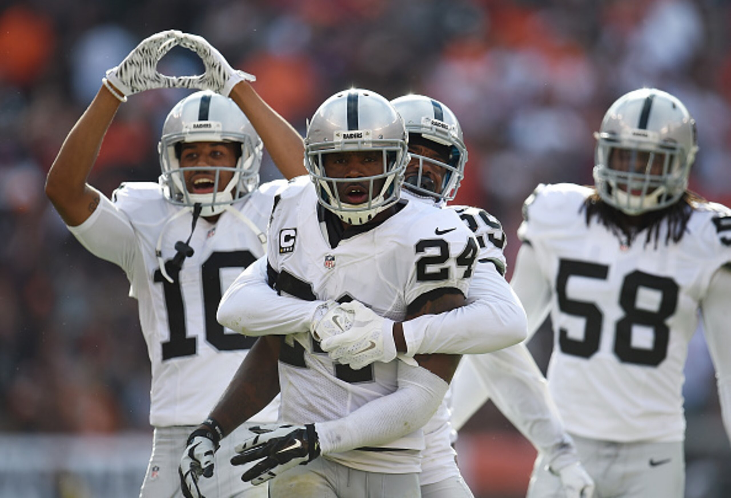 No. 24 CB Charles Woodson celebrating an interception