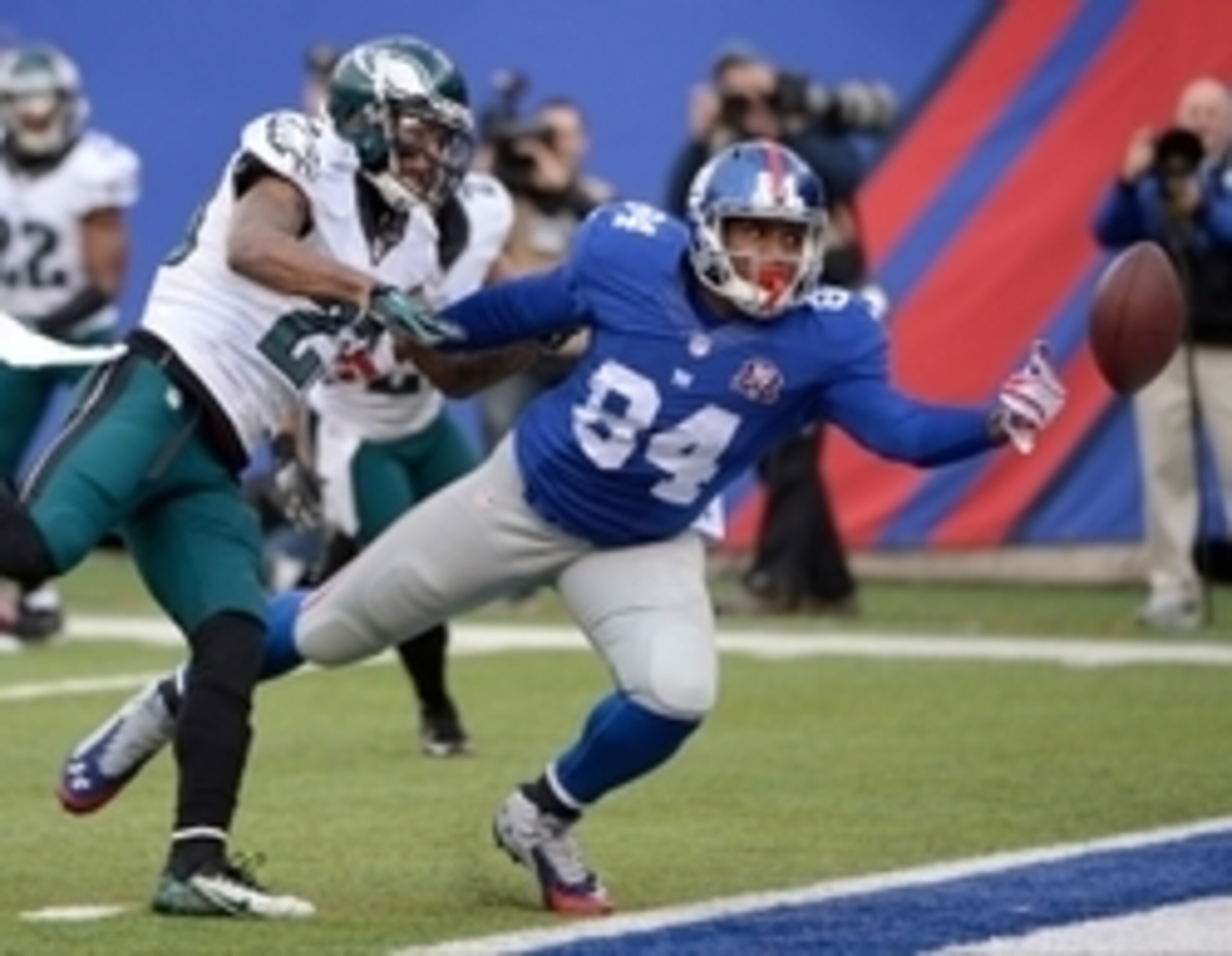 Dec 28, 2014; East Rutherford, NJ, USA; Philadelphia Eagles cornerback Nolan Carroll (23) breaks up a pass intended for New York Giants tight end Larry Donnell (84) in the end zone in the first half during the game at MetLife Stadium. Mandatory Credit: Ro