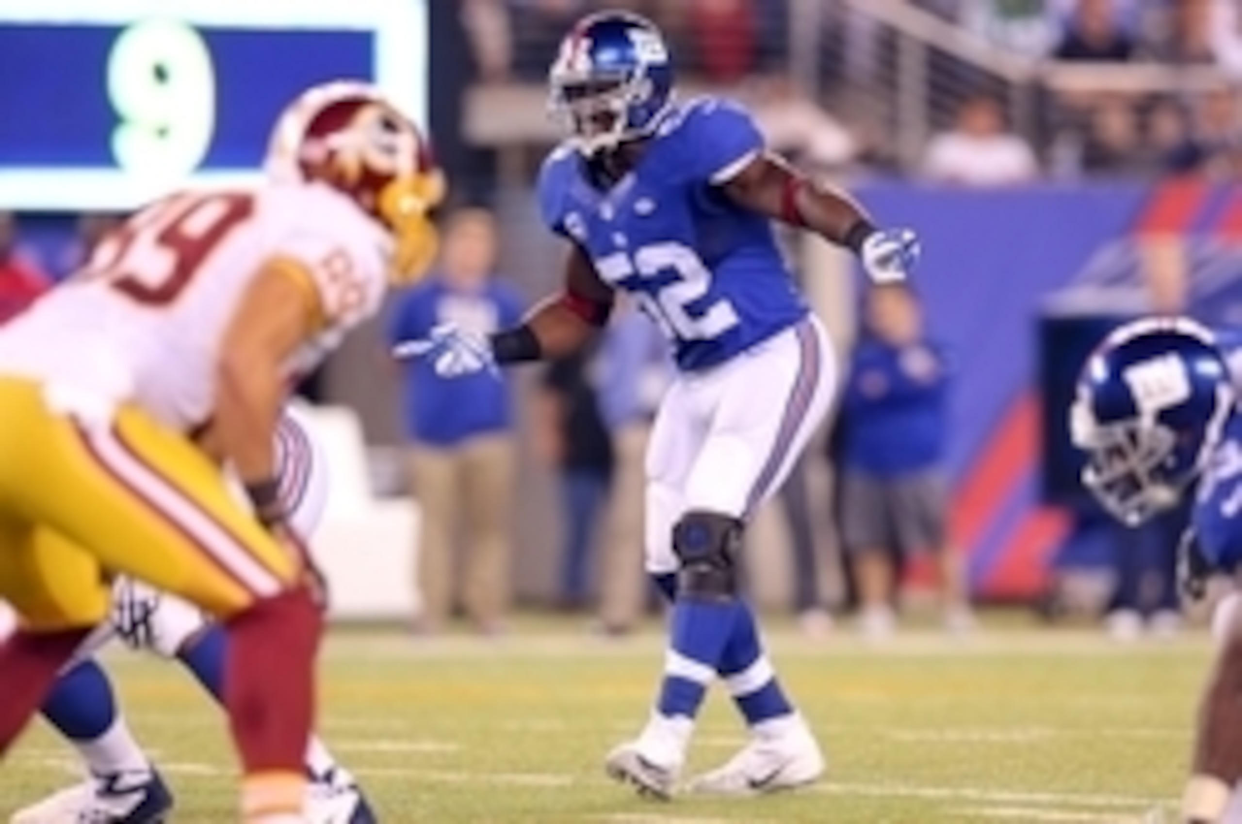 Sep 24, 2015; East Rutherford, NJ, USA; New York Giants linebacker Jon Beason (52) calls a defensive play against the Washington Redskins during the third quarter at MetLife Stadium. Mandatory Credit: Brad Penner-USA TODAY Sports