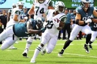 Bilal Powell fights for extra yards against the Eagles.