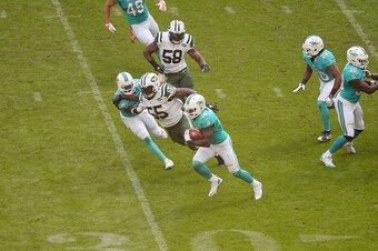 LONDON, ENGLAND - OCTOBER 04:  #14 Jarvis Landry completes a run during the annual NFL International Series as the New York Jets compete against the Miami Dolphins at Wembley Stadium on October 4, 2015 in London, England.  (Photo by Dave J Hogan/Getty Ima