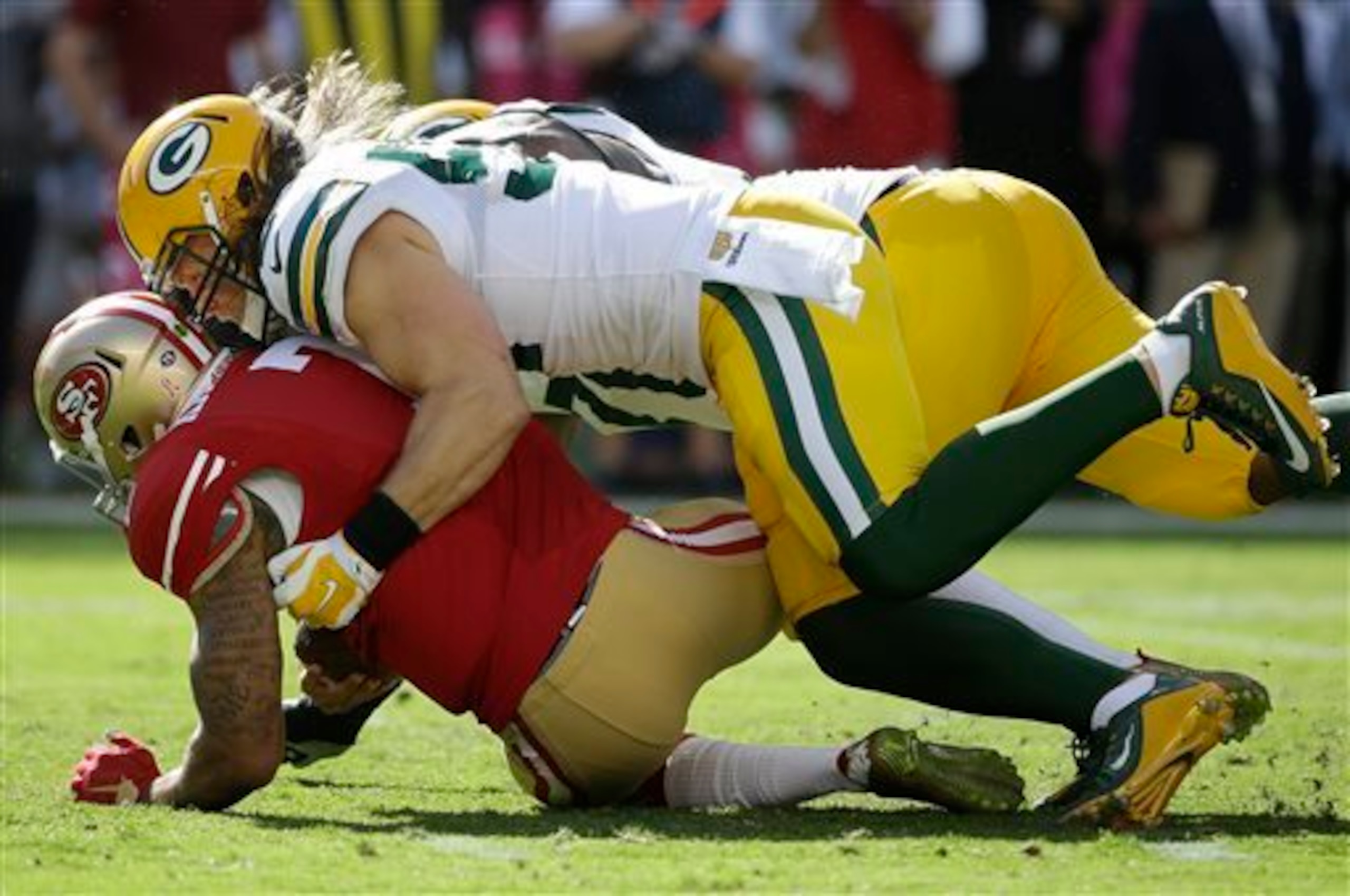 Green Bay's defense was swarming over quarterback Colin Kaepernick and the absent 49ers offense. Green Bay's defense was swarming over quarterback Colin Kaepernick and the absent 49ers offense.
