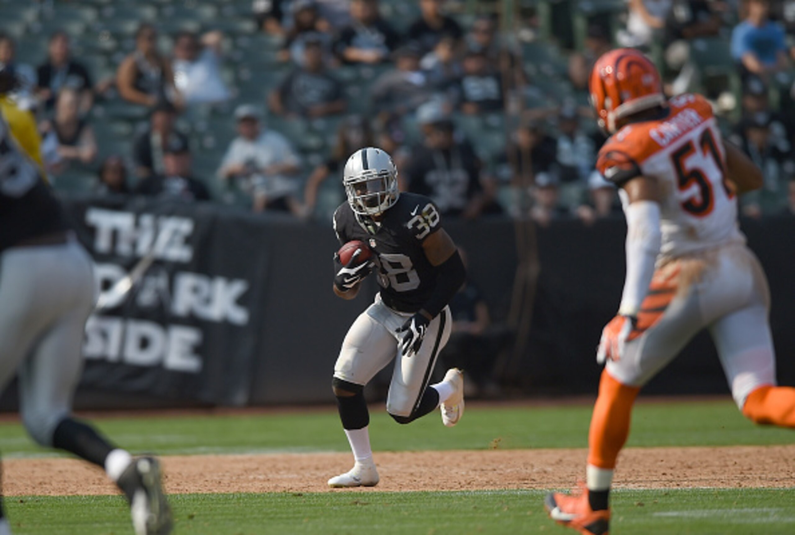 Raiders cornerback T.J. Carrie returning a punt