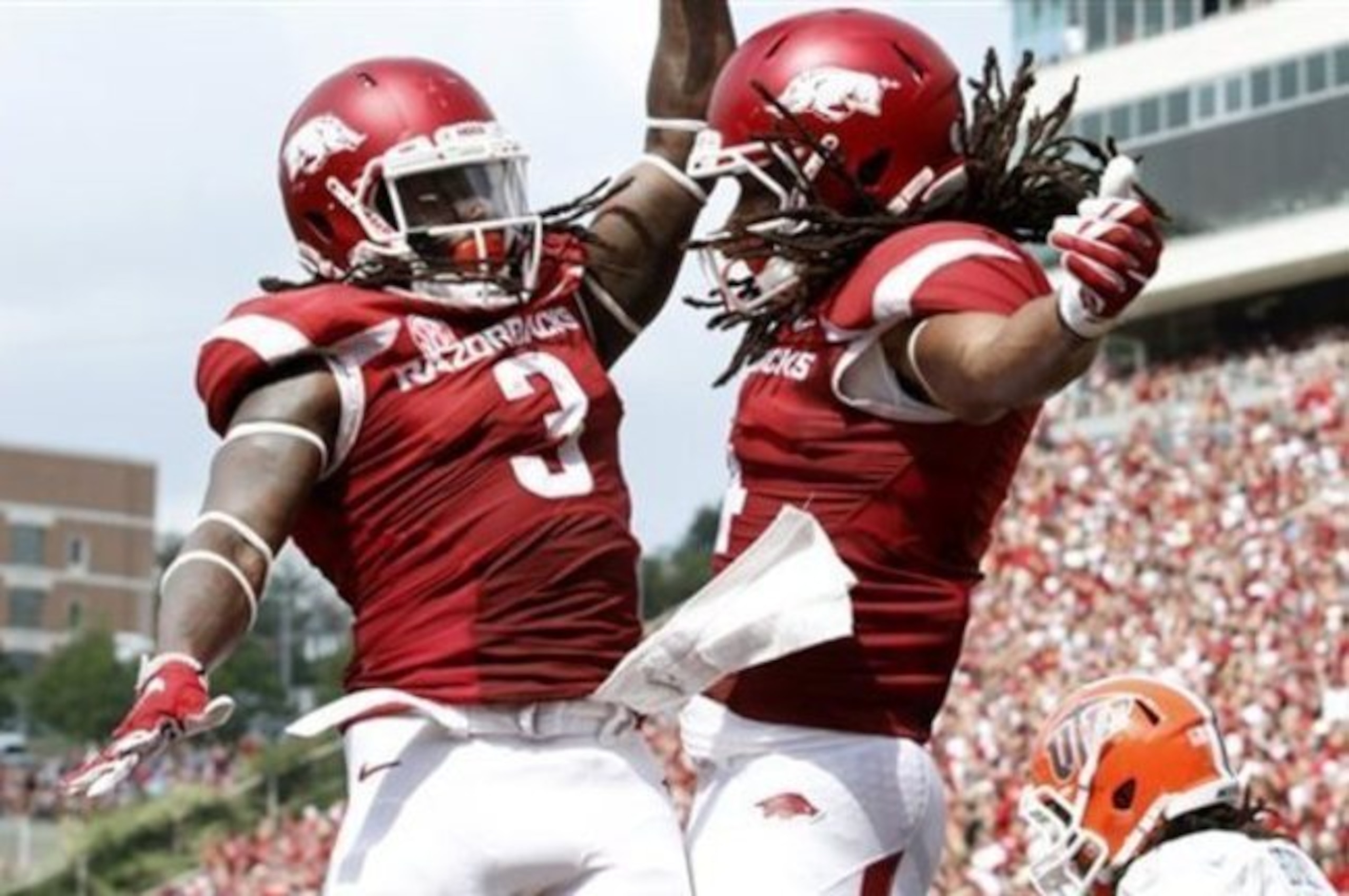 Arkansas RB Alex Collins (No. 3) and WR Keon Hatcher