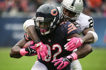 Raiders running back Latavius Murray making a tackle after an interception