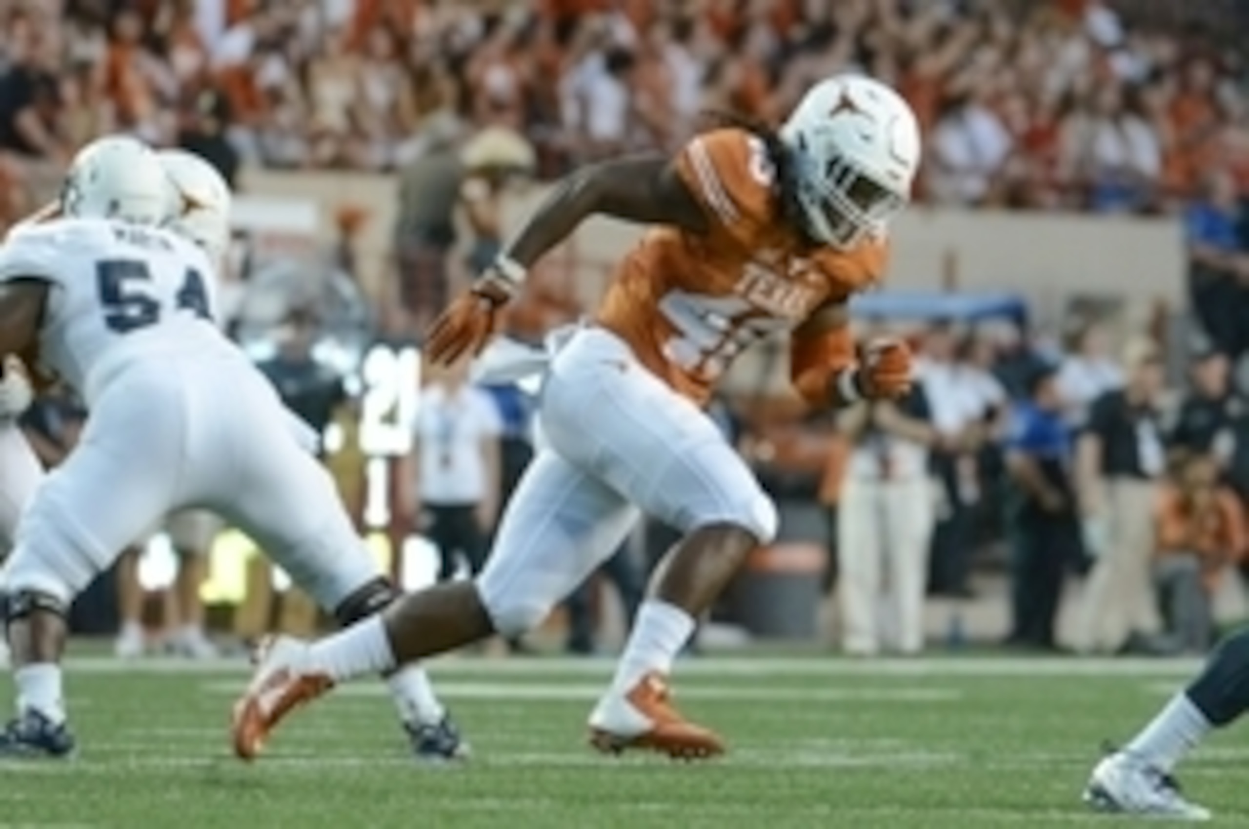 Sep 12, 2015; Austin, TX, USA; Texas Longhorns linebacker Malik Jefferson (46) pursues Rice Owls quarterback Driphus Jackson (6) during the first quarter at Darrell K Royal-Texas Memorial Stadium. Texas beat Rice 42-28. Mandatory Credit: Brendan Maloney-U