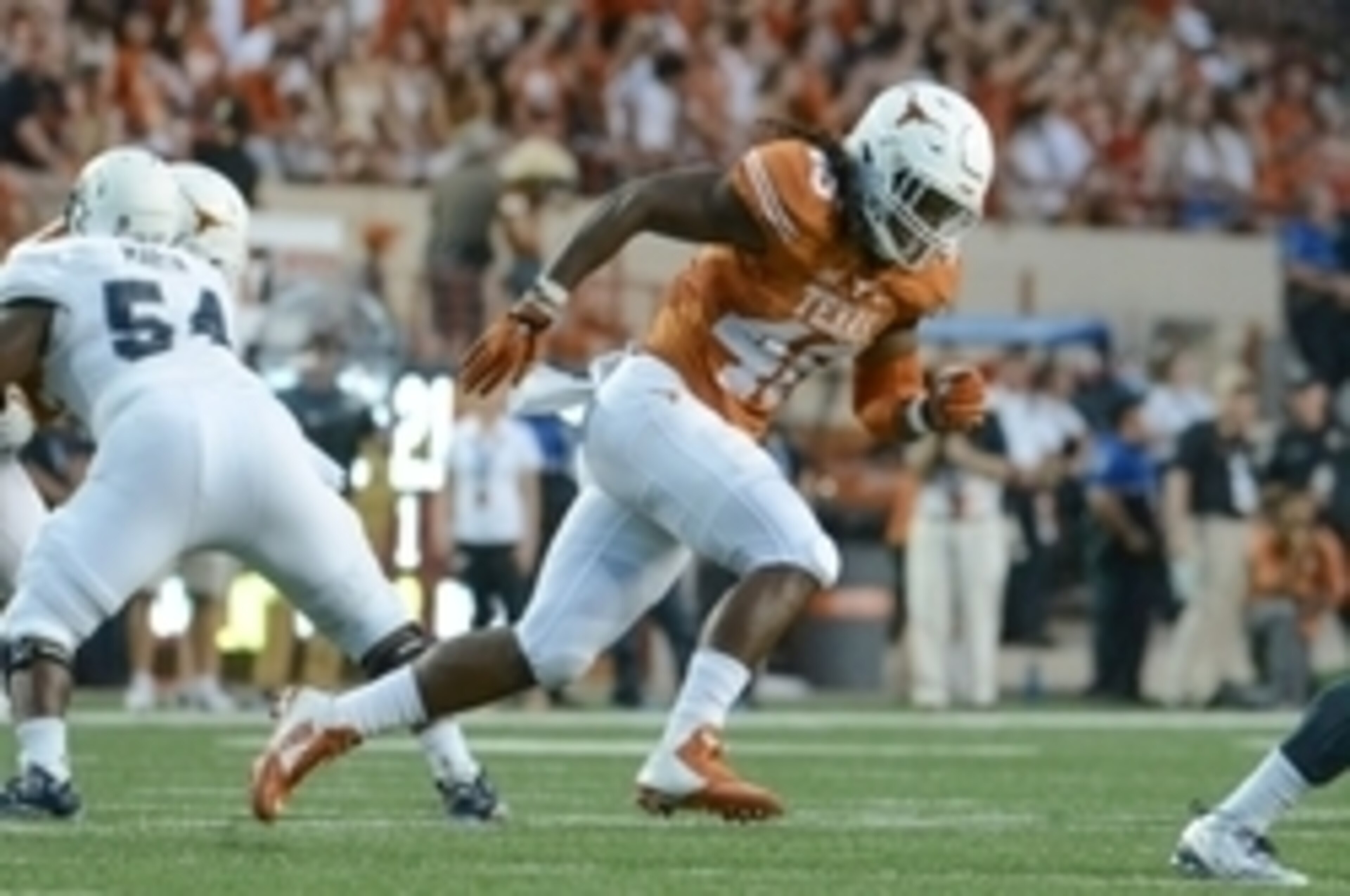 Sep 12, 2015; Austin, TX, USA; Texas Longhorns linebacker Malik Jefferson (46) pursues Rice Owls quarterback Driphus Jackson (6) during the first quarter at Darrell K Royal-Texas Memorial Stadium. Texas beat Rice 42-28. Mandatory Credit: Brendan Maloney-U