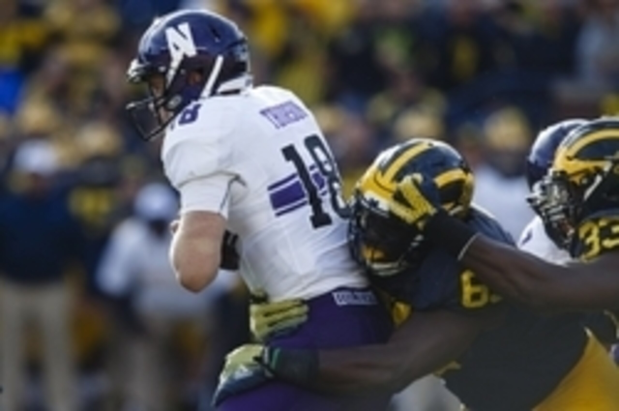 Michigan DT Willie Henry (right)