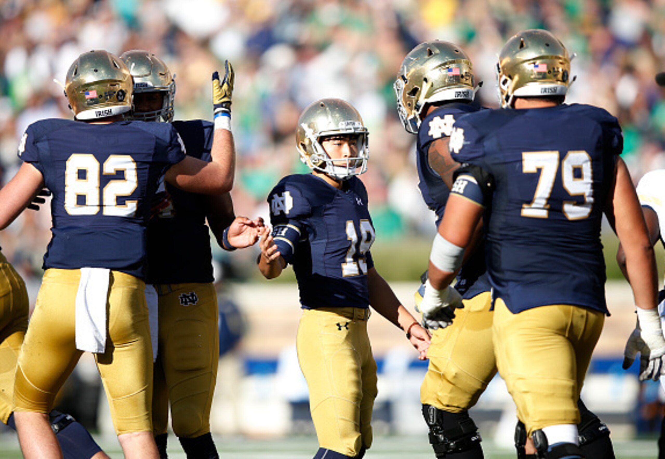 Notre Dame K Justin Yoon (center)