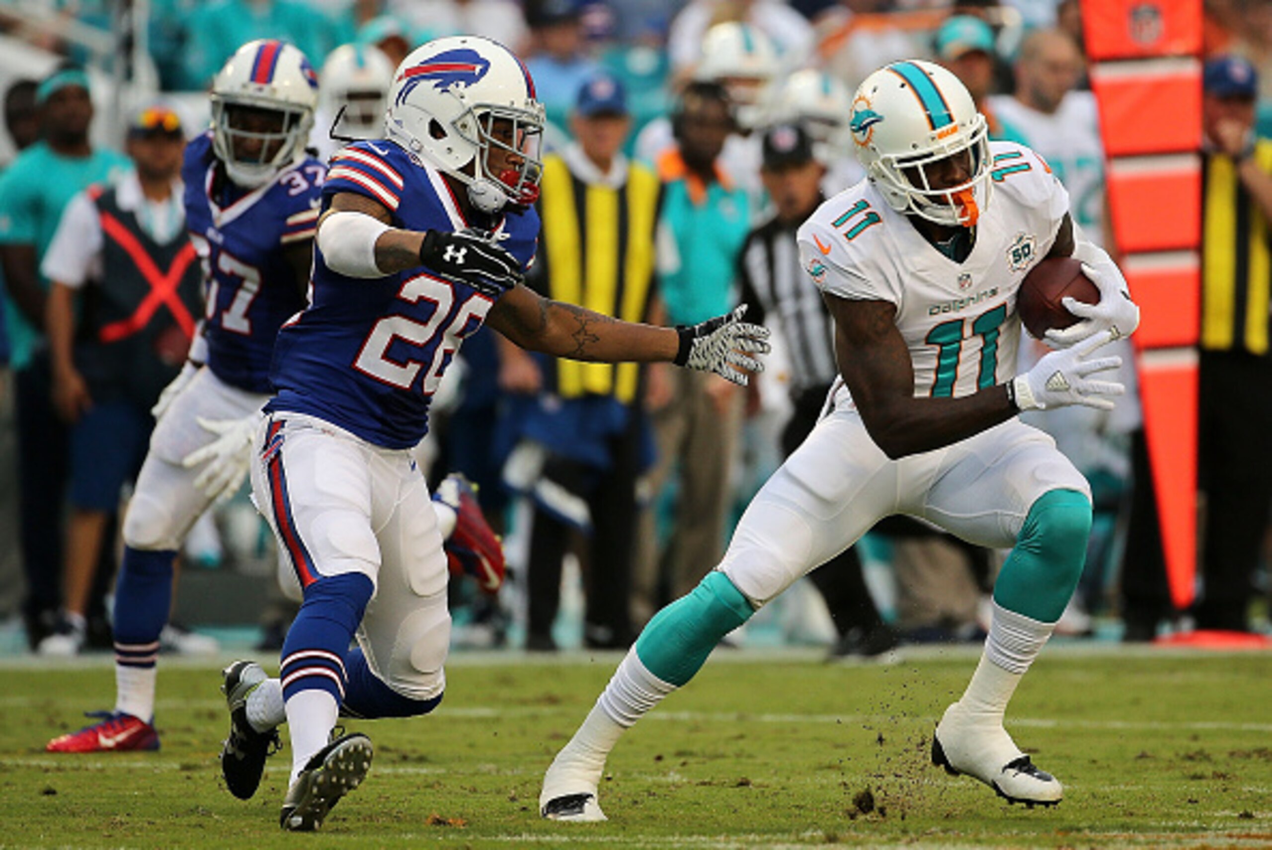 MIAMI GARDENS, FL - SEPTEMBER 27: DeVante Parker #11 of the Miami Dolphins is defended by Anthony Dixon #26 of the Buffalo Bills during a game at Sun Life Stadium on September 27, 2015 in Miami Gardens, Florida. (Photo by Mike Ehrmann/Getty Images) MIAMI GARDENS, FL - SEPTEMBER 27: DeVante Parker #11 of the Miami Dolphins is defended by Anthony Dixon #26 of the Buffalo Bills during a game at Sun Life Stadium on September 27, 2015 in Miami Gardens, Florida. (Photo by Mike Ehrmann/Getty Images)
