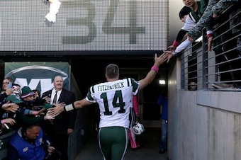 Ryan Fitzpatrick walks off the field after the Jets victory.