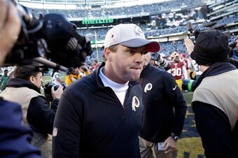 Jay Gruden walks off the field after the Redskins loss.