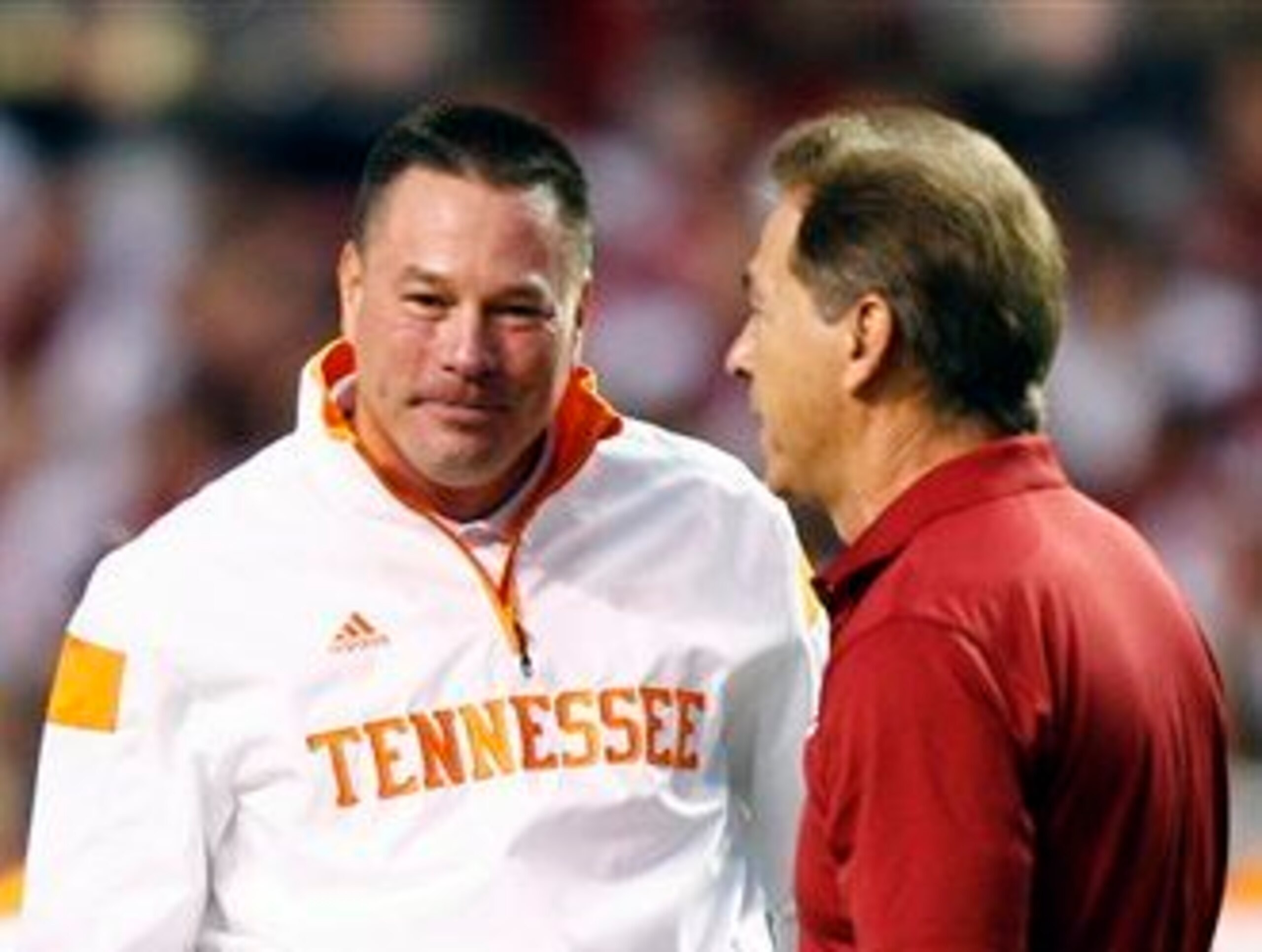 Butch Jones and Nick Saban briefly talk before last year's game in Knoxville.