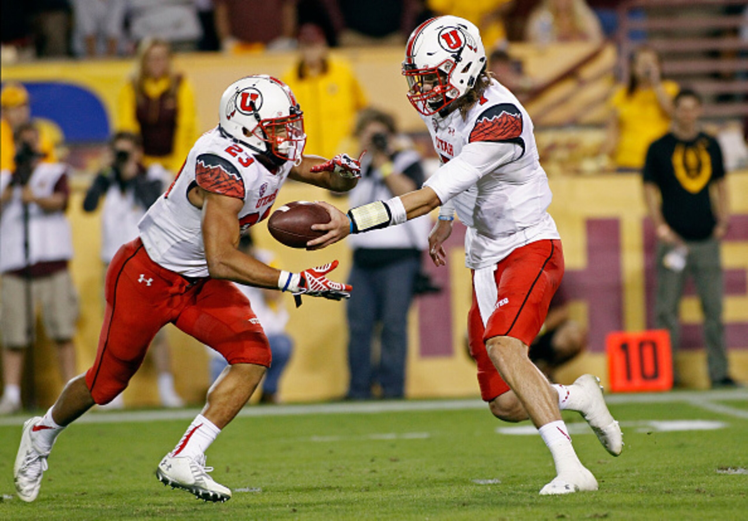 Utah RB Devontae Booker and QB Travis Wilson Utah RB Devontae Booker and QB Travis Wilson