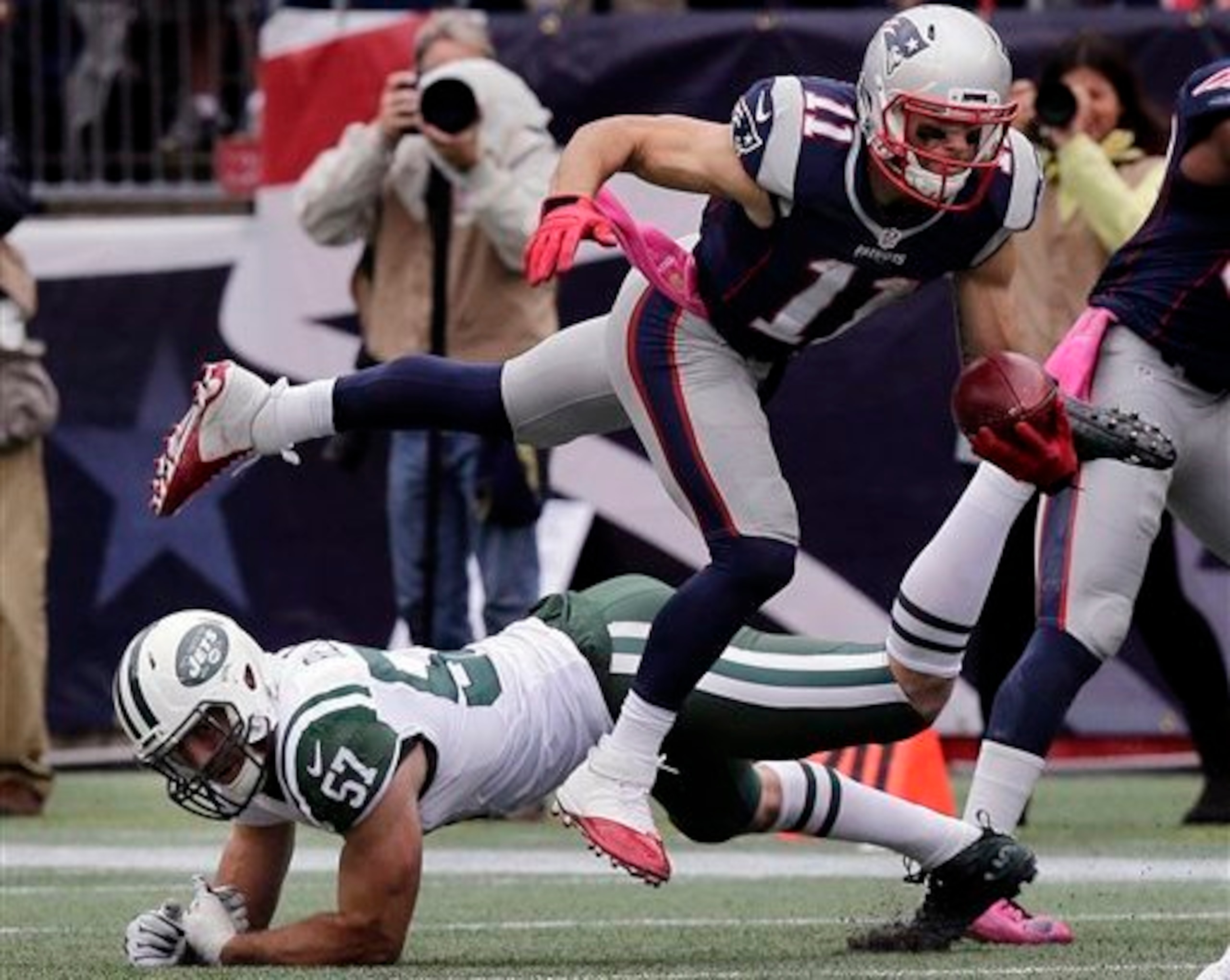 Julian Edelman fights for extra yards against the Jets.