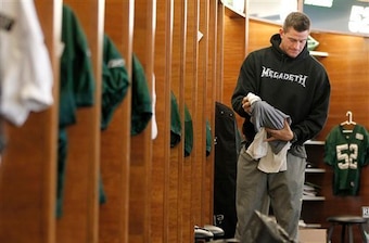 Steve Weatherford stands in the Jets locker room.
